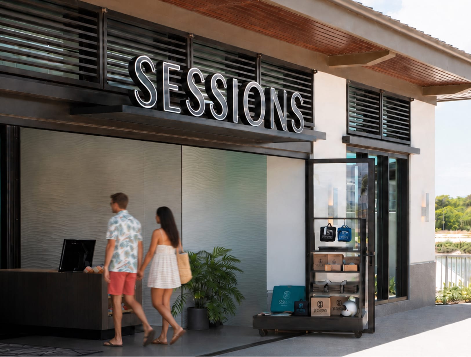 Sessions retail storefront with illuminated channel letter sign and wave-textured facade at Wai Kai, Ewa Beach, Oahu, environmental graphic design by RSM Design.