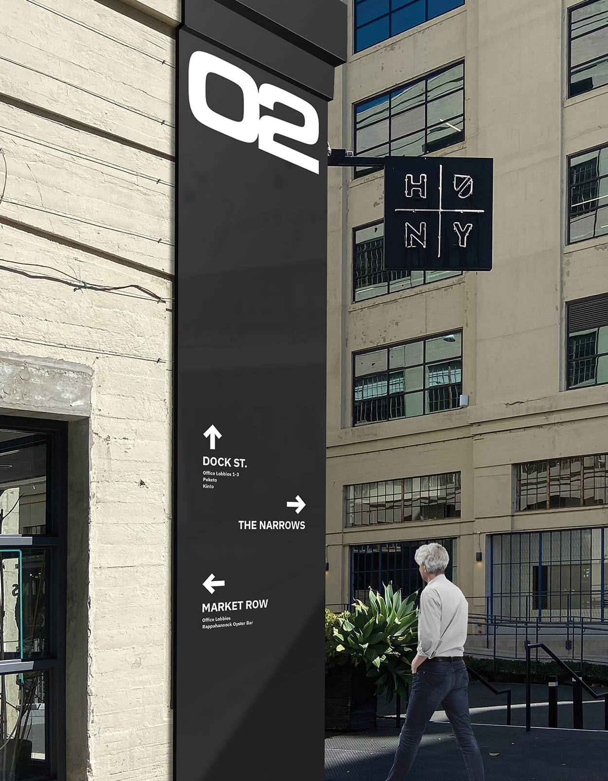 Building 02 directional sign with arrows to Dock St., The Narrows, and Market Row at ROW DTLA - wayfinding and environmental graphic design by RSM Design