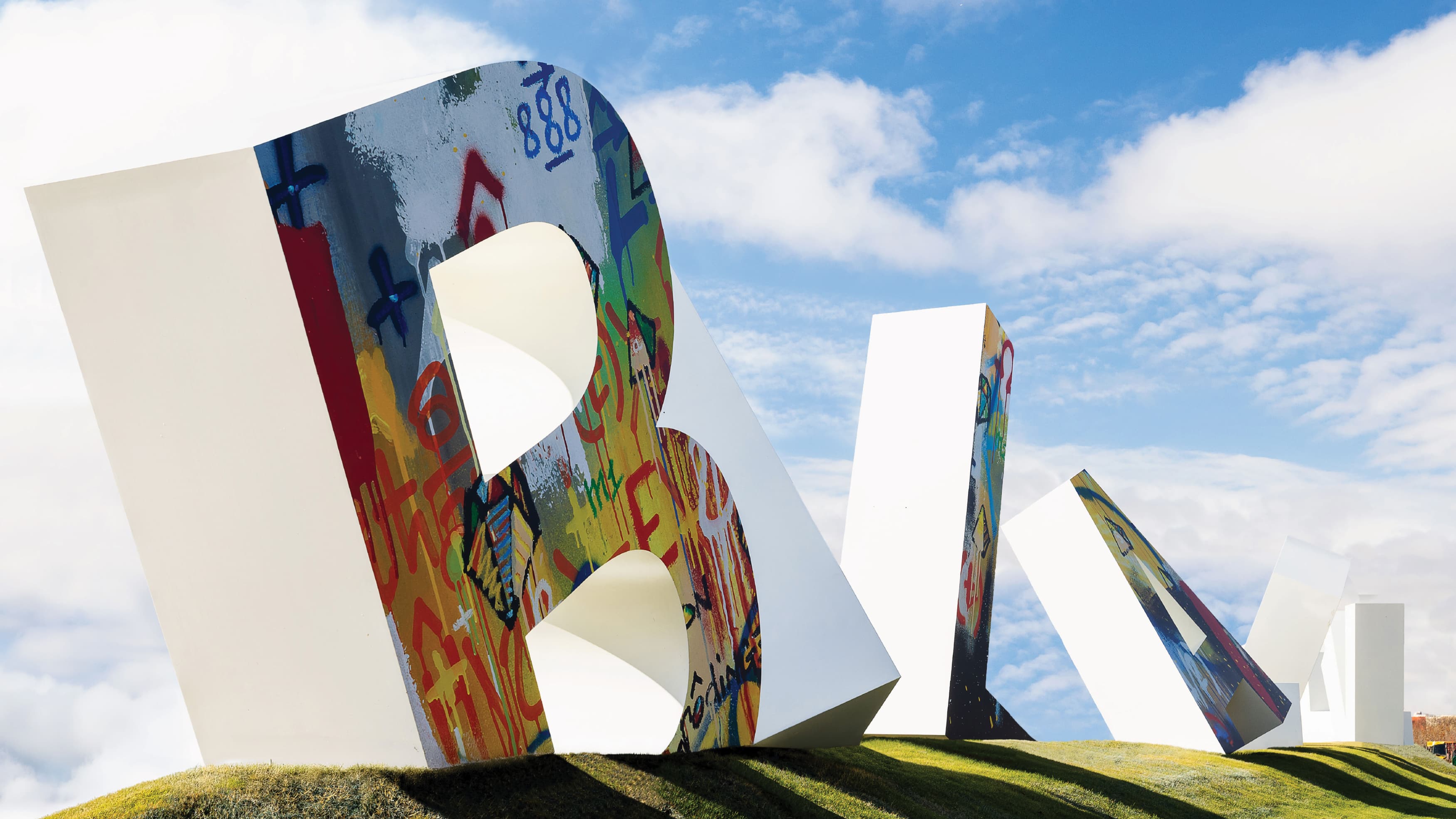 Image of the oversized letters for the entrance of Bel Air Village, a residential community in Sherman, Texas. Letter signage was designed by RSM Design in collaboration with artist Cyril Kongo.