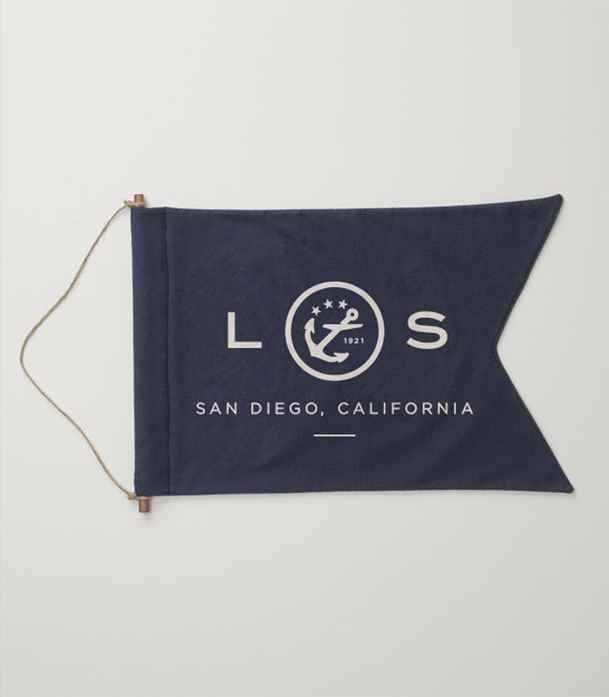 Navy blue pennant flag with a rope tie, printed in white with 'L,' an anchor emblem dated 1921, and 'S,' plus 'San Diego, California' text below.