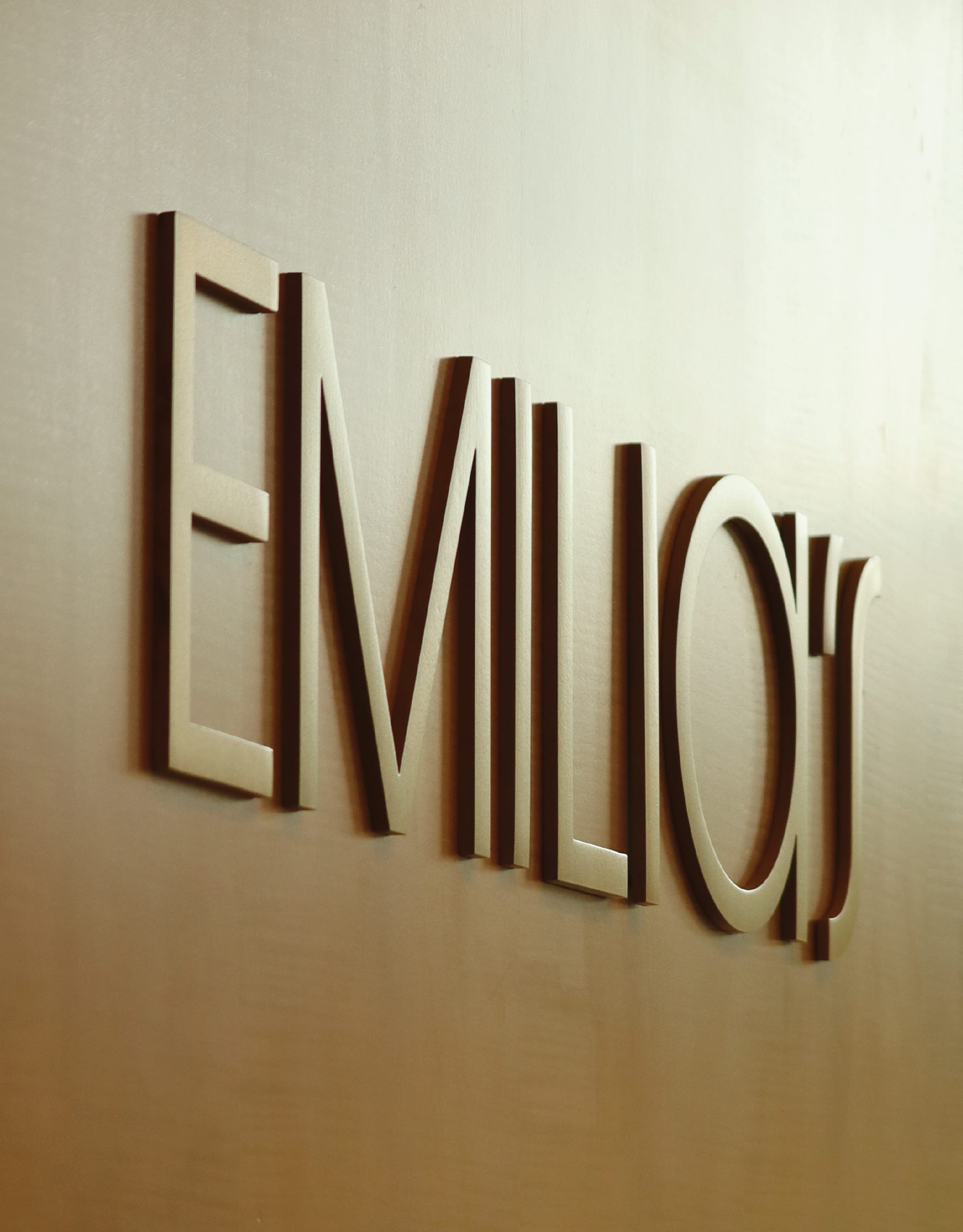 Emilia's restaurant dimensional wall lettering with bold raised metallic gold signage at The Crescent Hotel, highlighting an upscale hotel dining destination
