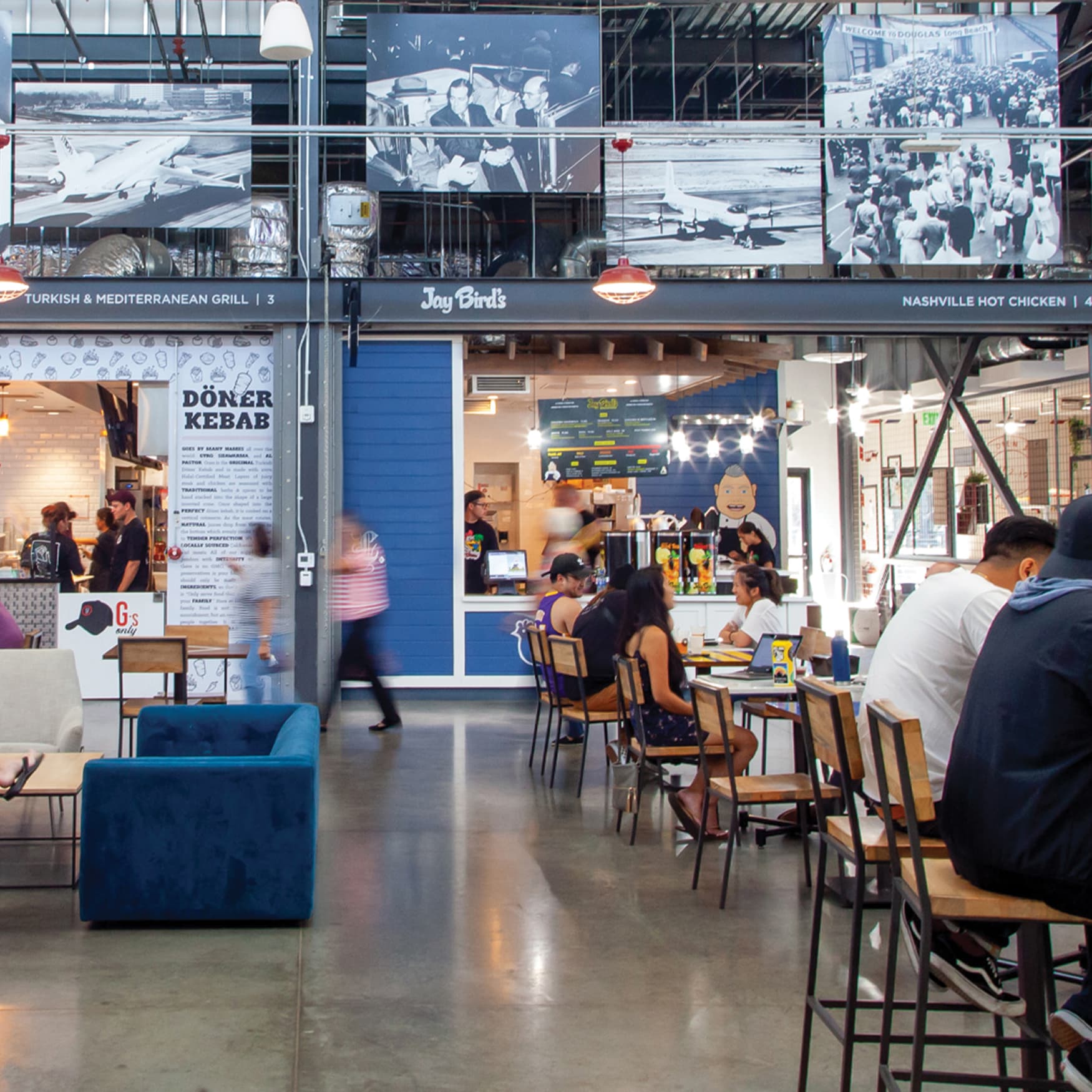The Hangar food hall in Long Beach with open tables and multiple tenants