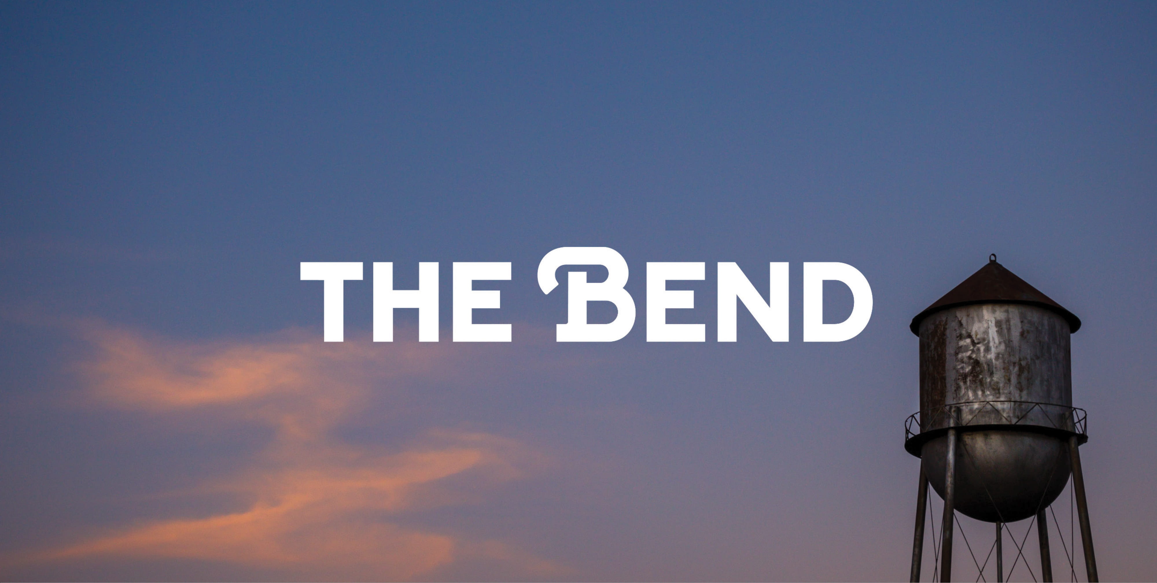 Hero image for The Bend Houston brand featuring historic water tower and bold “The Bend” typography, illustrating brand strategy, visual identity design, and placemaking for a mixed-use retail, dining, and entertainment destination.