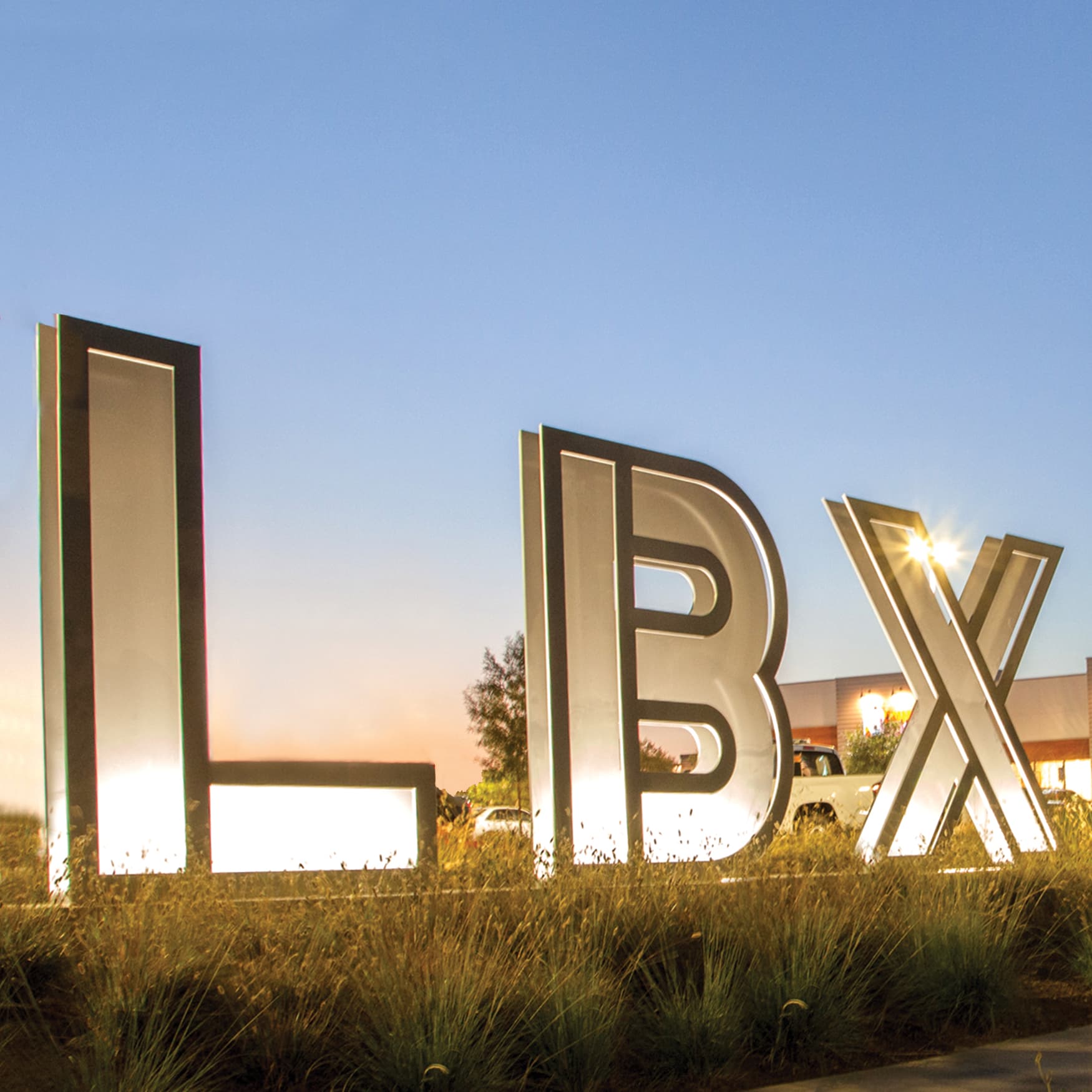 Long Beach Exchange monument large letter signage illuminated at dusk