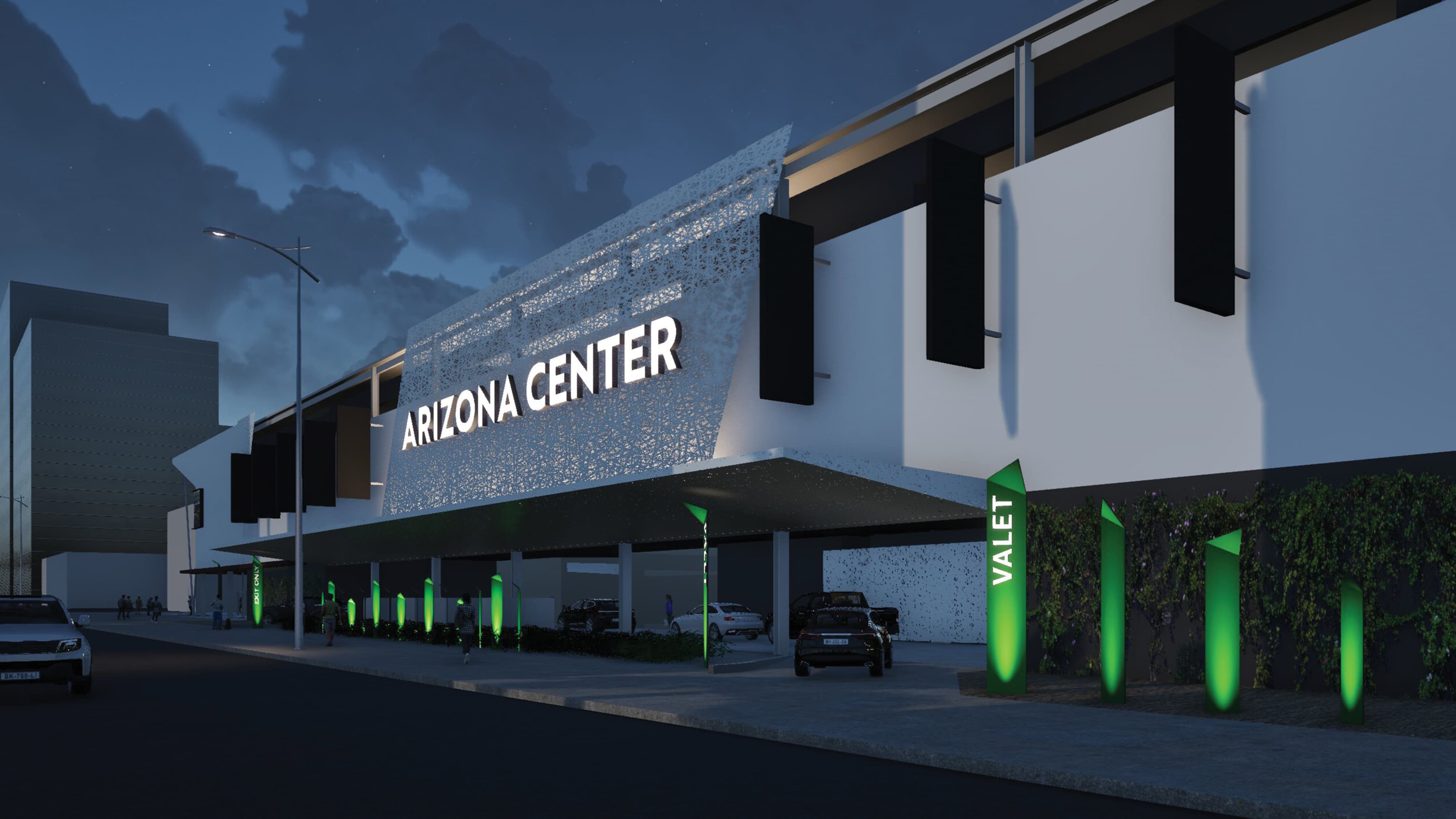 Large building facade with a unique facade perforated material and illuminated identity sign mounted to the wall. Vertical signs at ground level announcing the vehicular approach and entry to the valet area. 