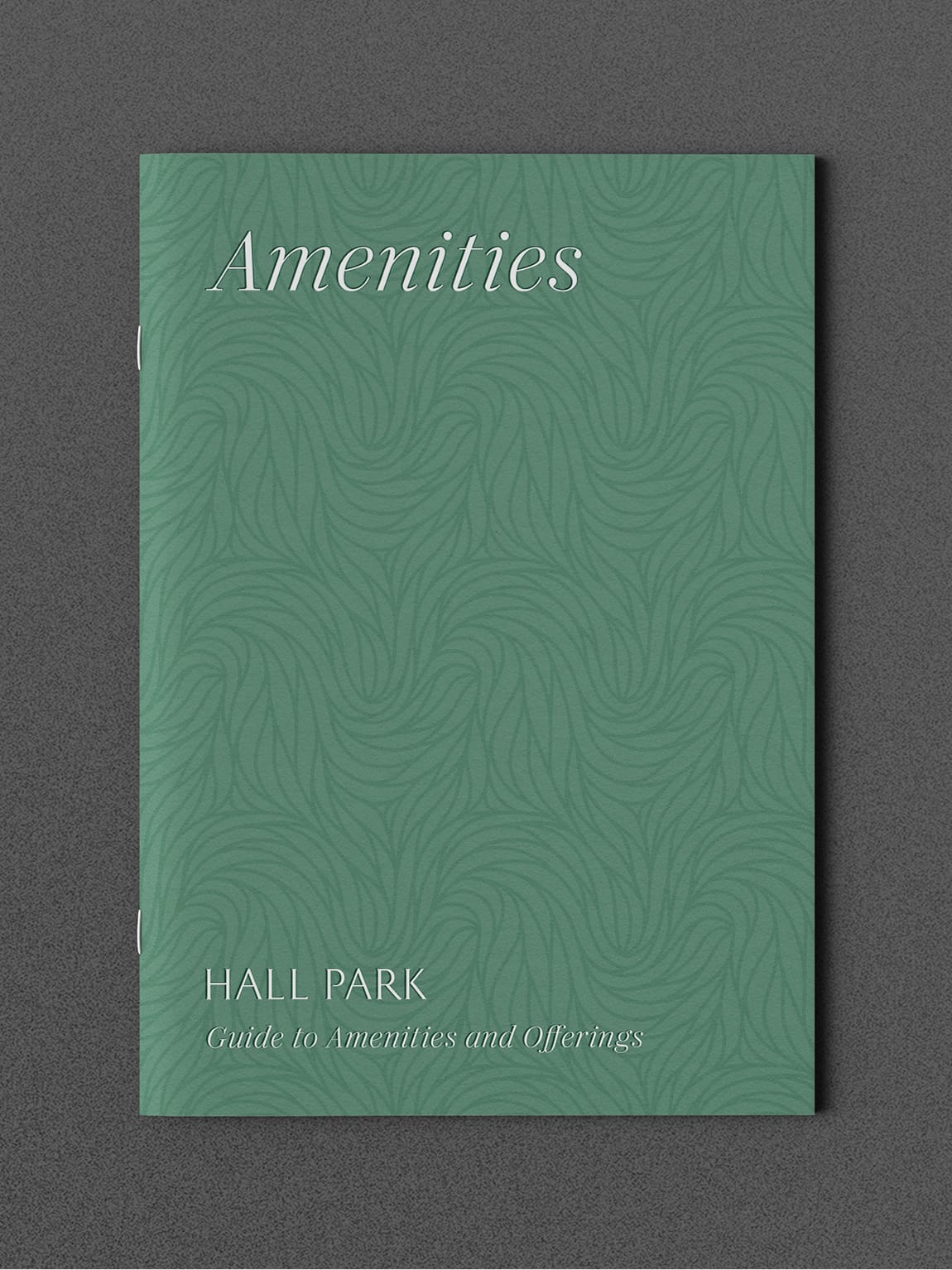 Green patterned cover of the "Amenities Guide to Amenities and Offerings" booklet for Hall Park - brand identity and print collateral by RSM Design