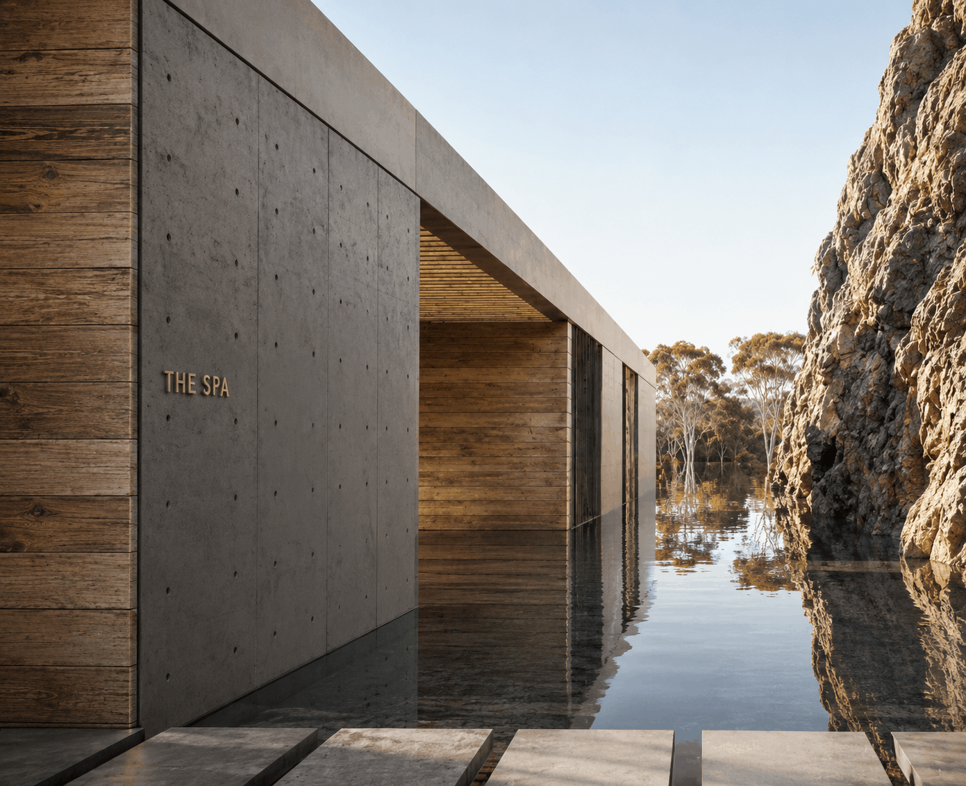 Rendering of 'The Spa' entrance featuring a concrete and wood facade beside a still reflecting pool, framed by a large rock formation and trees in the distance.