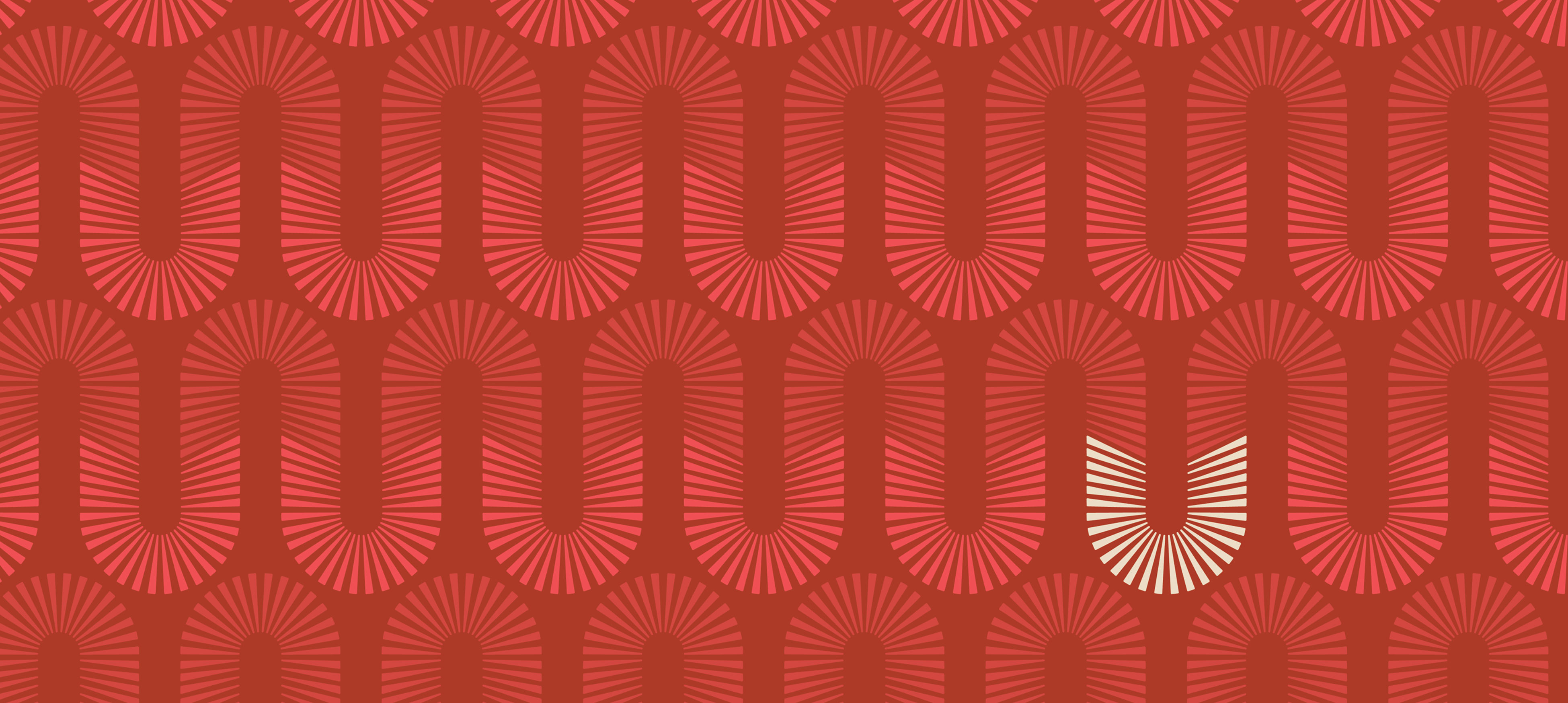 Repeating U emblem pattern in red tones with one cream highlight, Uptown Tucson brand graphic by RSM Design