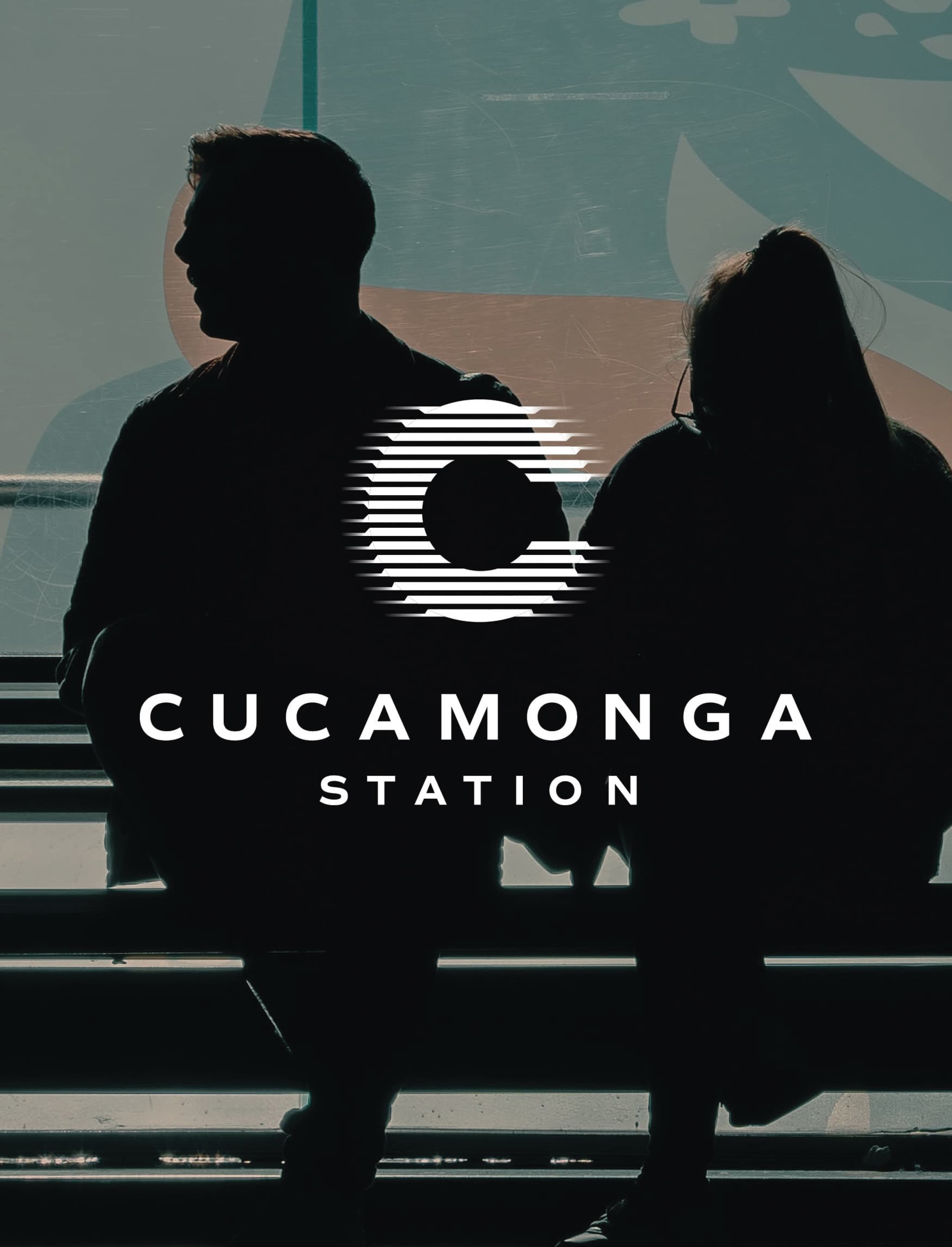 Two silhouetted commuters seated against a large-scale environmental mural in teal, terracotta, and sage tones, with the Cucamonga Station brand identity — a horizontal-striped circular "C" logomark above the wordmark in white — overlaid in the foreground — showcasing RSM Design's branding and visual identity, art programs and public art, and placemaking services applied to the transit market