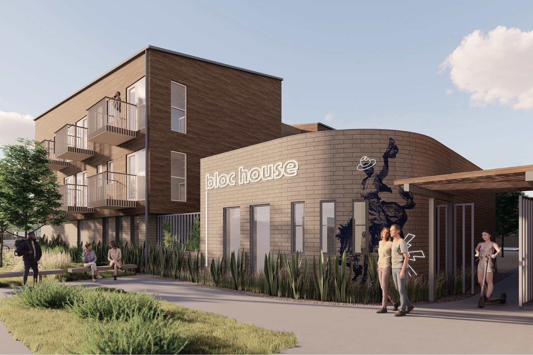 Exterior architectural rendering of Bloc House in Dallas, showing a multi-story residential building with warm wood cladding and cantilevered balconies, connected to a curved single-story brick pavilion. The pavilion features an illuminated "bloc house" wordmark and a large graphic mural of a rodeo cowboy. Residents walk, sit on benches, and ride scooters along the landscaped pedestrian path, with ornamental grasses and shade trees lining the streetscape.