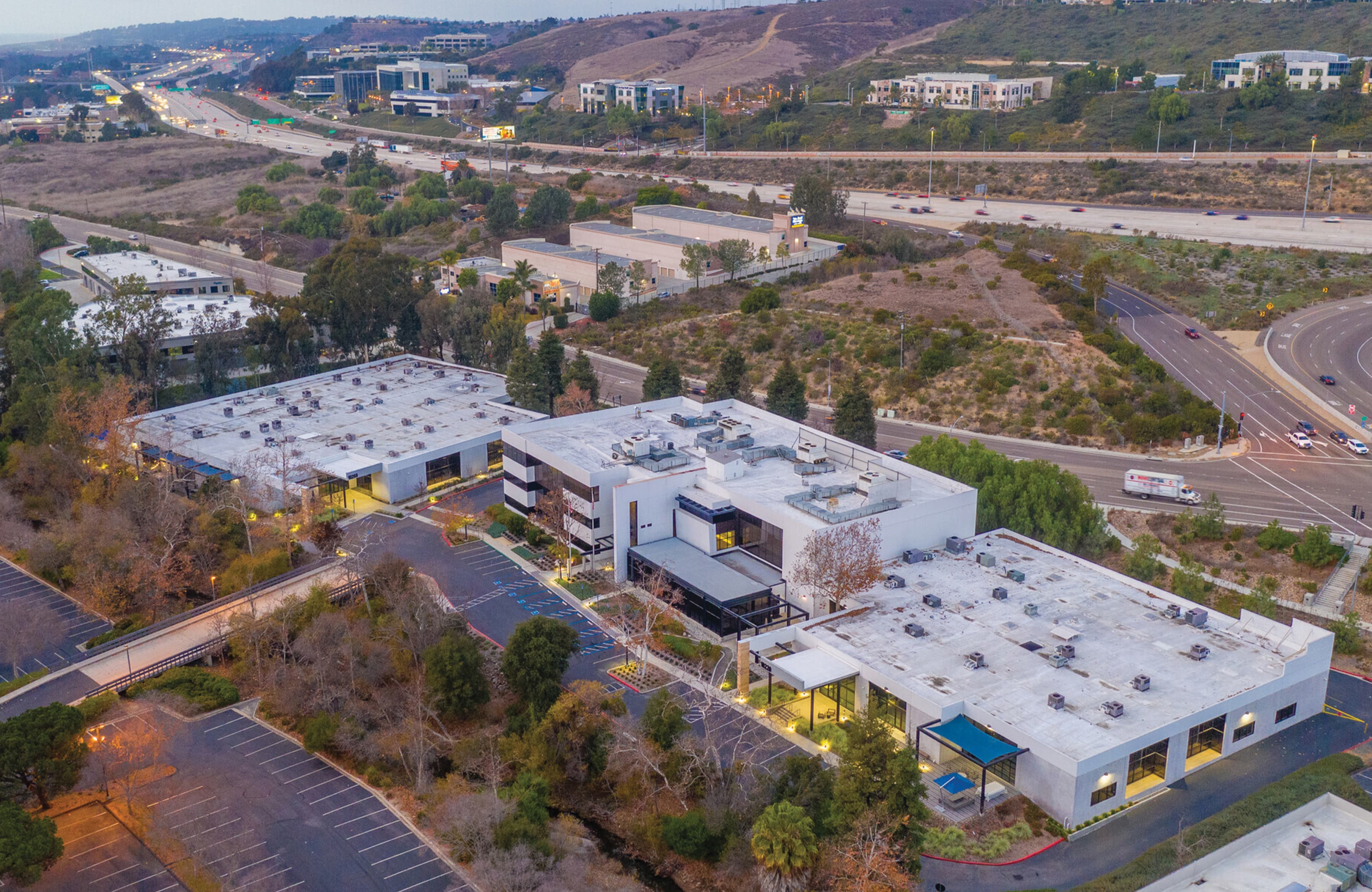 Aerial view of Creekside Labs innovation campus in San Diego, highlighting corporate workplace environments where environmental graphic design, wayfinding, and brand identity integrate architecture, landscape, and placemaking.