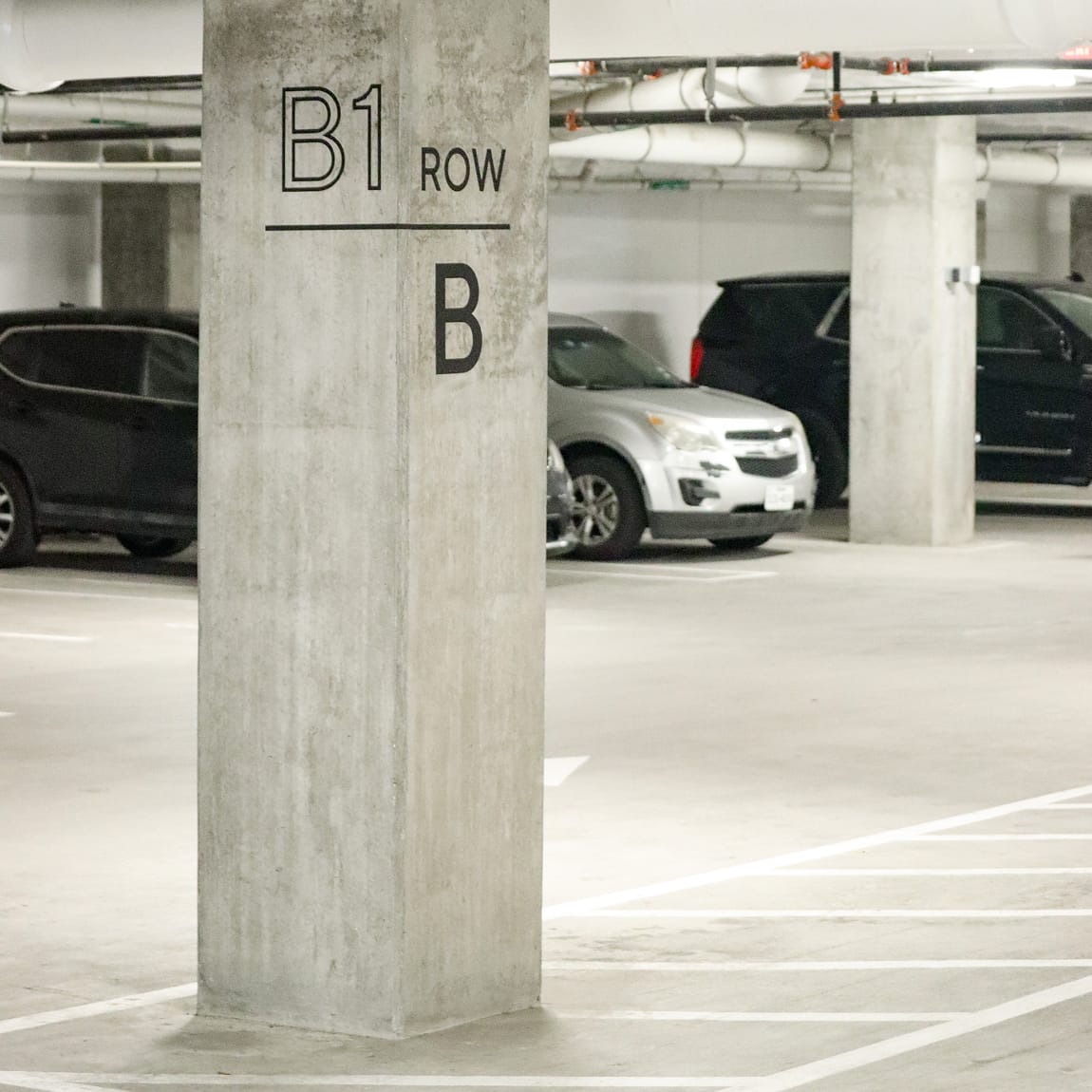 Parking garage column marked "B1 Row, B" at Maple Terrace - environmental graphic design by RSM Design