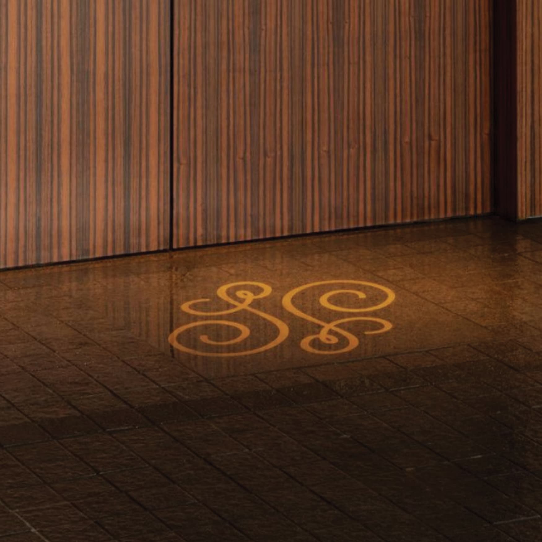 Floor graphic of the Hotel Swexan logo mark. Graphic designed by RSM Design for the Hotel Swexan in Dallas, Texas. 