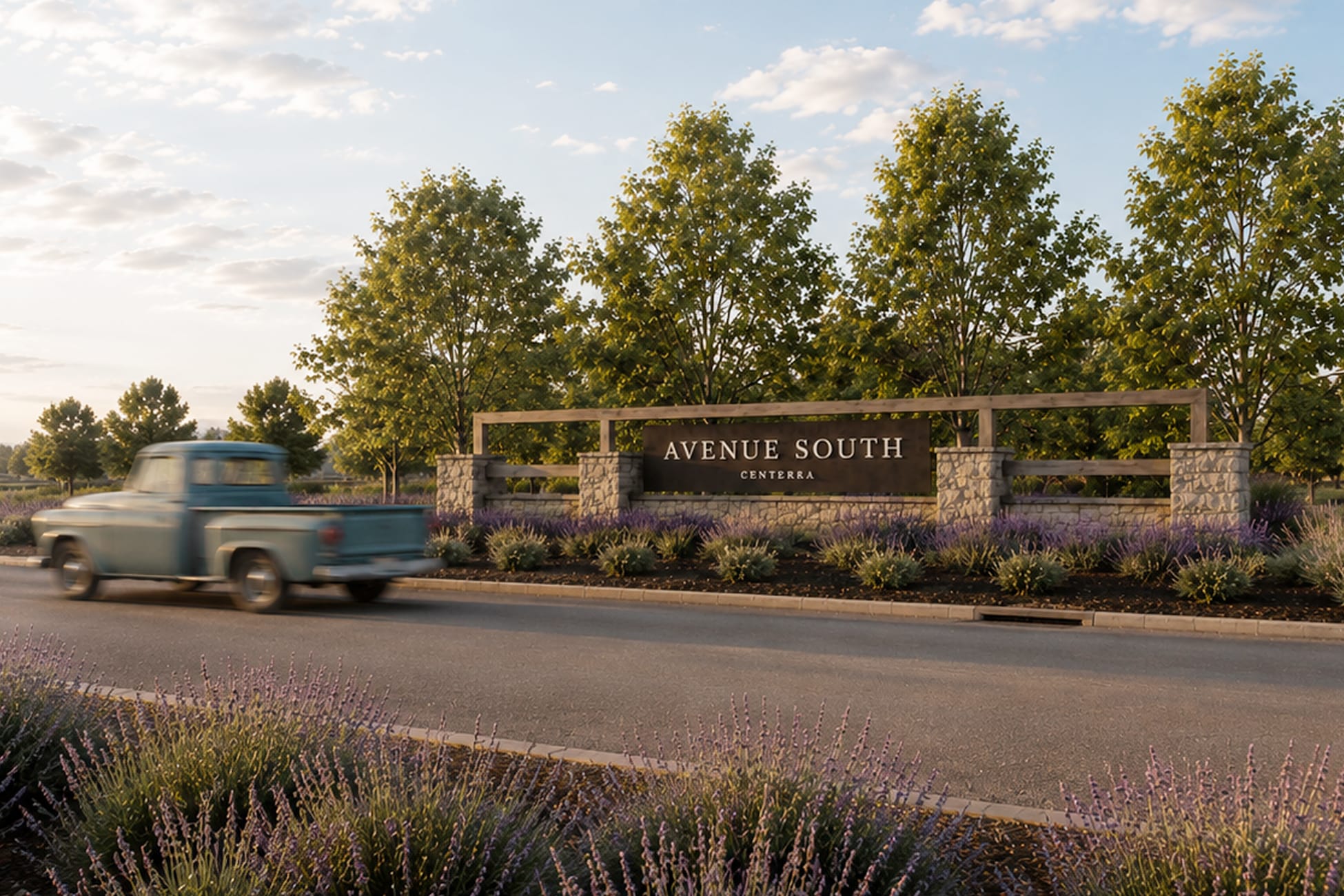 Avenue South Centerra monument sign with stone pillars and wood trellis framed by lavender landscaping and passing vintage truck, environmental graphic design by RSM Design.