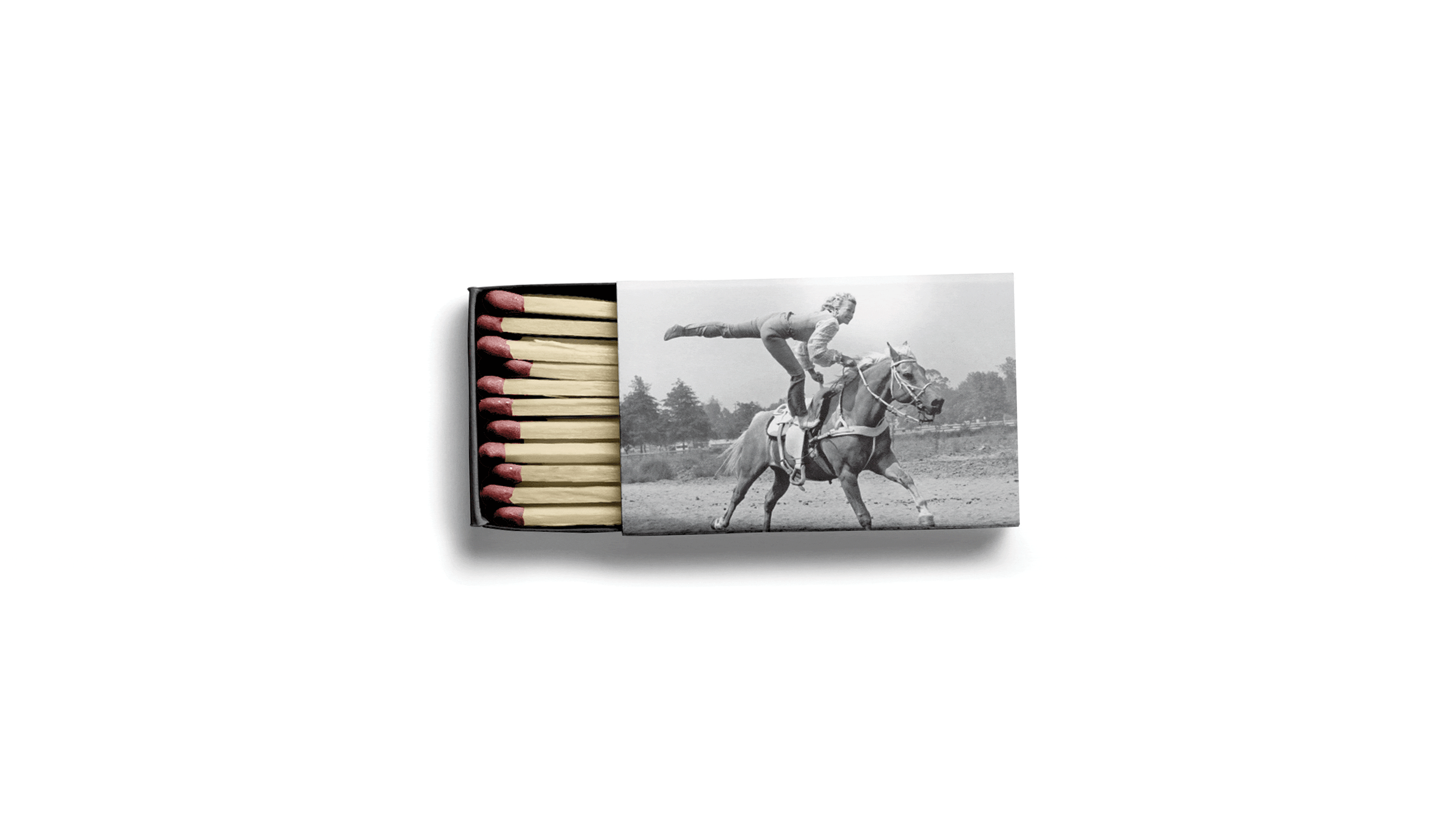 Trick Rider matchbox with vintage photo of a trick rider standing atop a galloping horse, Omni PGA Frisco Resort, brand identity by RSM Design.