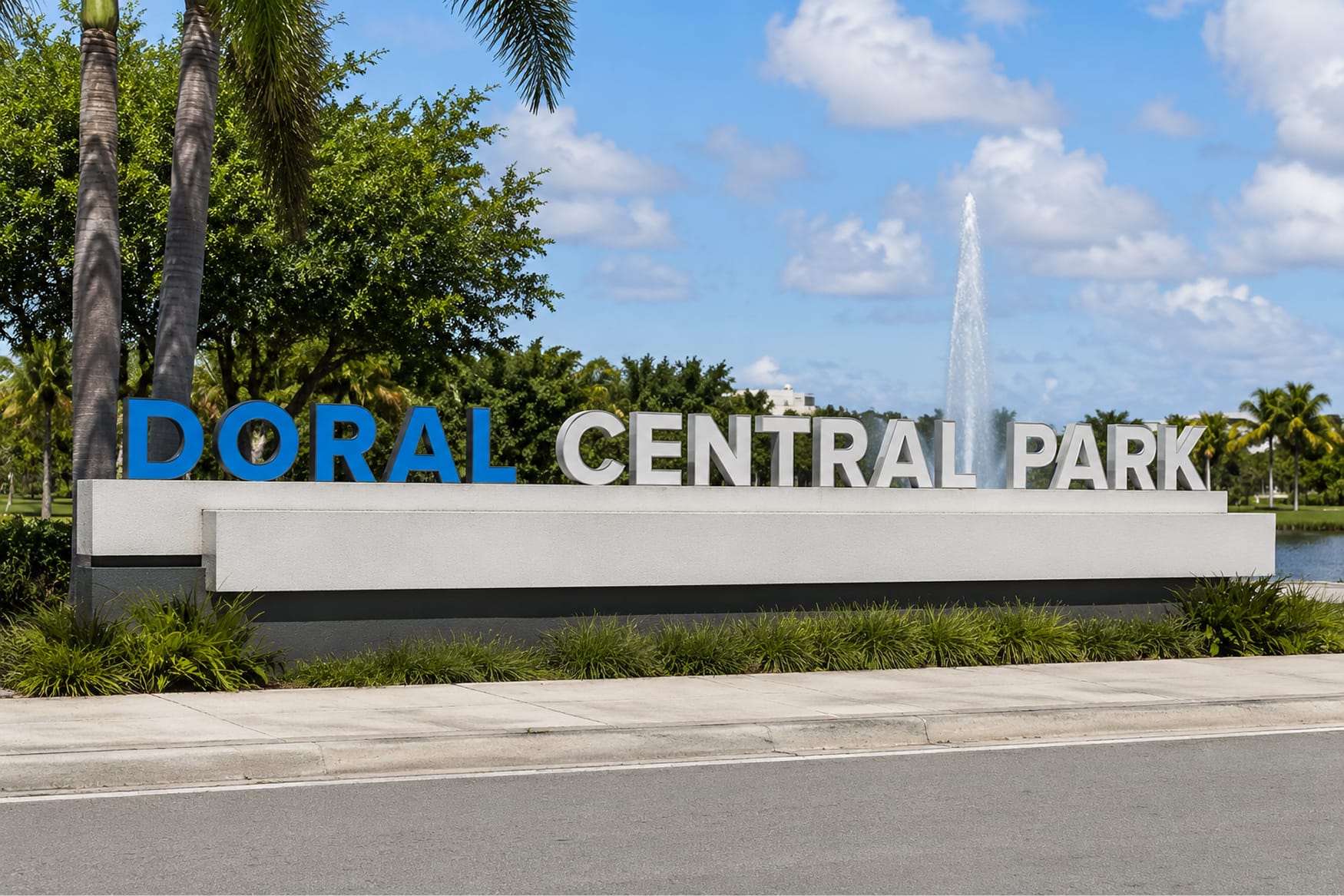 Doral Central Park entry monument sign with dimensional lettering and fountain backdrop — environmental graphic design by RSM Design
