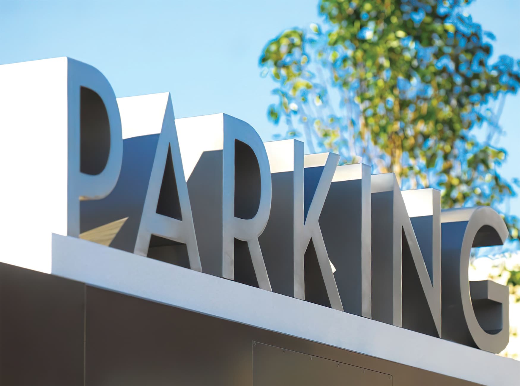 Natick Collection, New England's largest mixed-use retail destination, commissioned RSM Design to create a brand identity as well as a placemaking, identity, and wayfinding features. Parking Signage. 