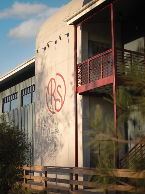 River Street Marketplace RS monogram logo on curved building facade, brand identity by RSM Design
