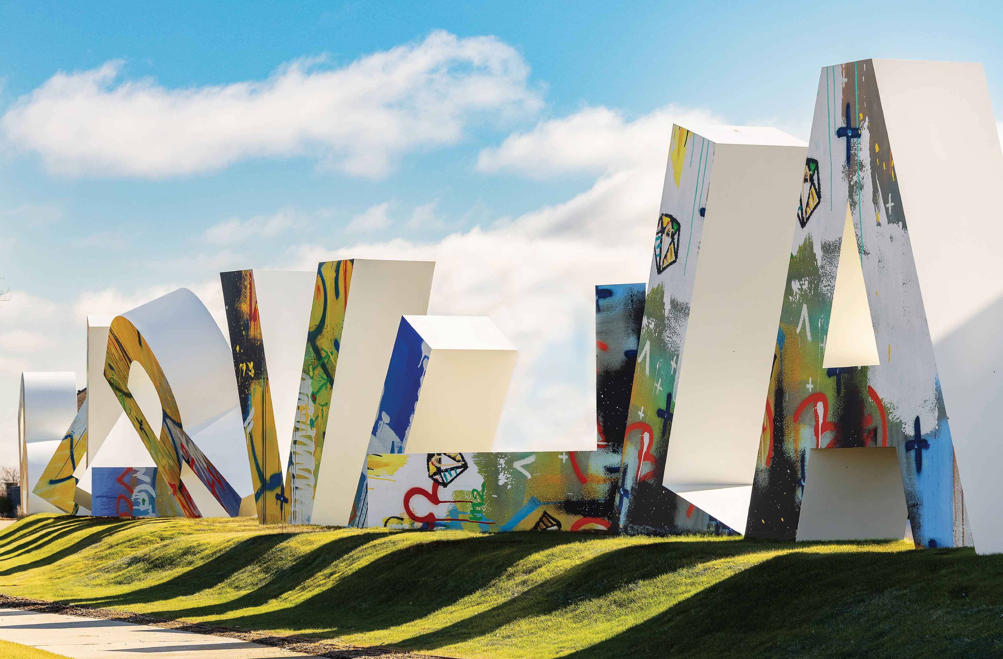 
Bel Air Village Entrance: Oversized Letter Sculpture in Sherman, Texas

Explore the striking oversized letter sculptures at the entrance of Bel Air Village, a premier residential community in Sherman, Texas. This vibrant letter signage was masterfully designed by RSM Design in collaboration with renowned artist Cyril Kongo. The dynamic and colorful installation welcomes residents and visitors, embodying the spirit of the community.