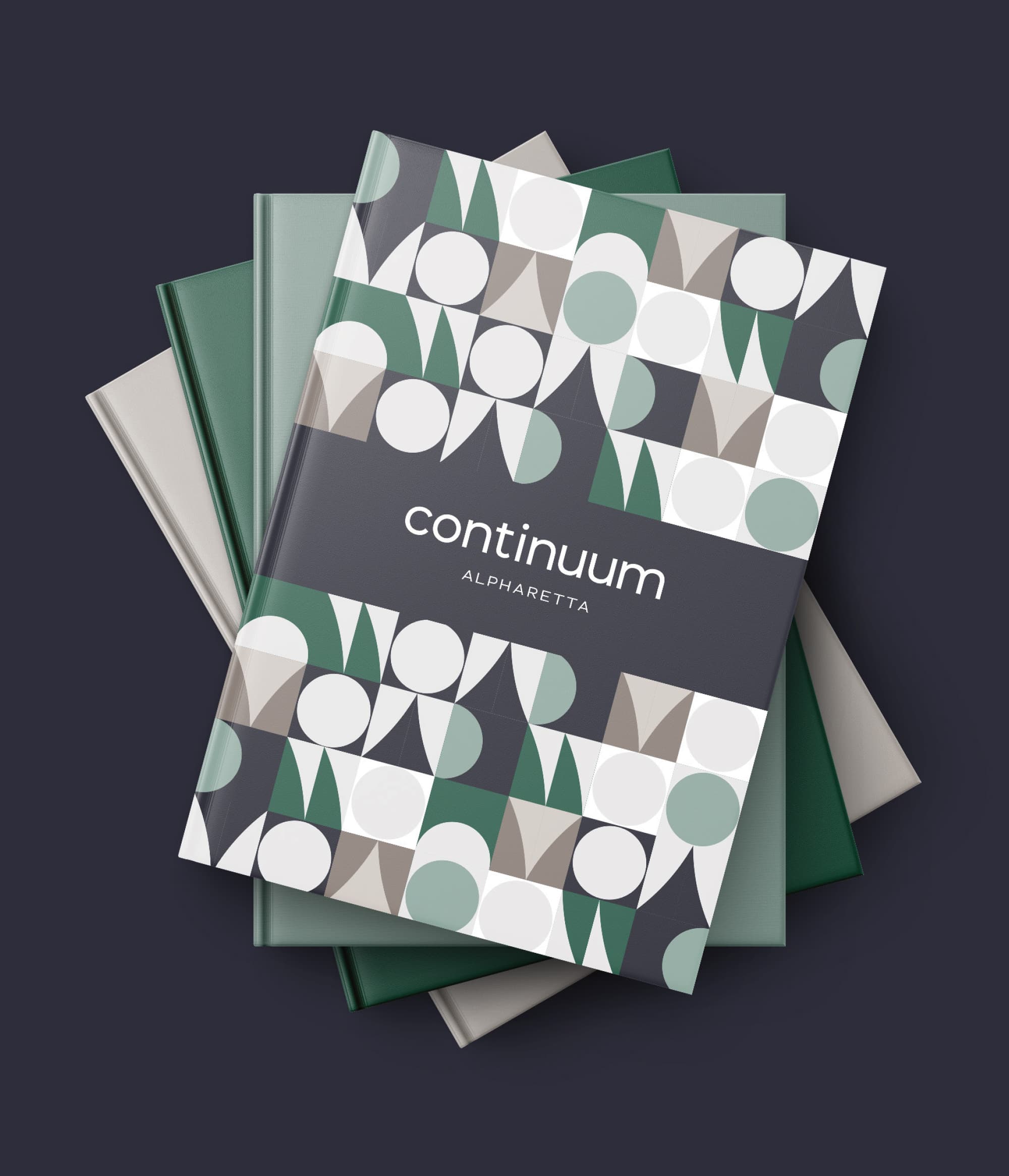RSM Design print collateral and visual identity design for Continuum Alpharetta, featuring a stack of branded hardcover books or leasing guides with a geometric pattern cover in forest green, sage, taupe, and white with the Continuum Alpharetta logo on a dark navy band, showcasing how branding and visual identity, print and digital collateral, and specialty graphics extend a cohesive branded environment across every marketing touchpoint for a mixed-use workplace, health and wellness, and residential community development.