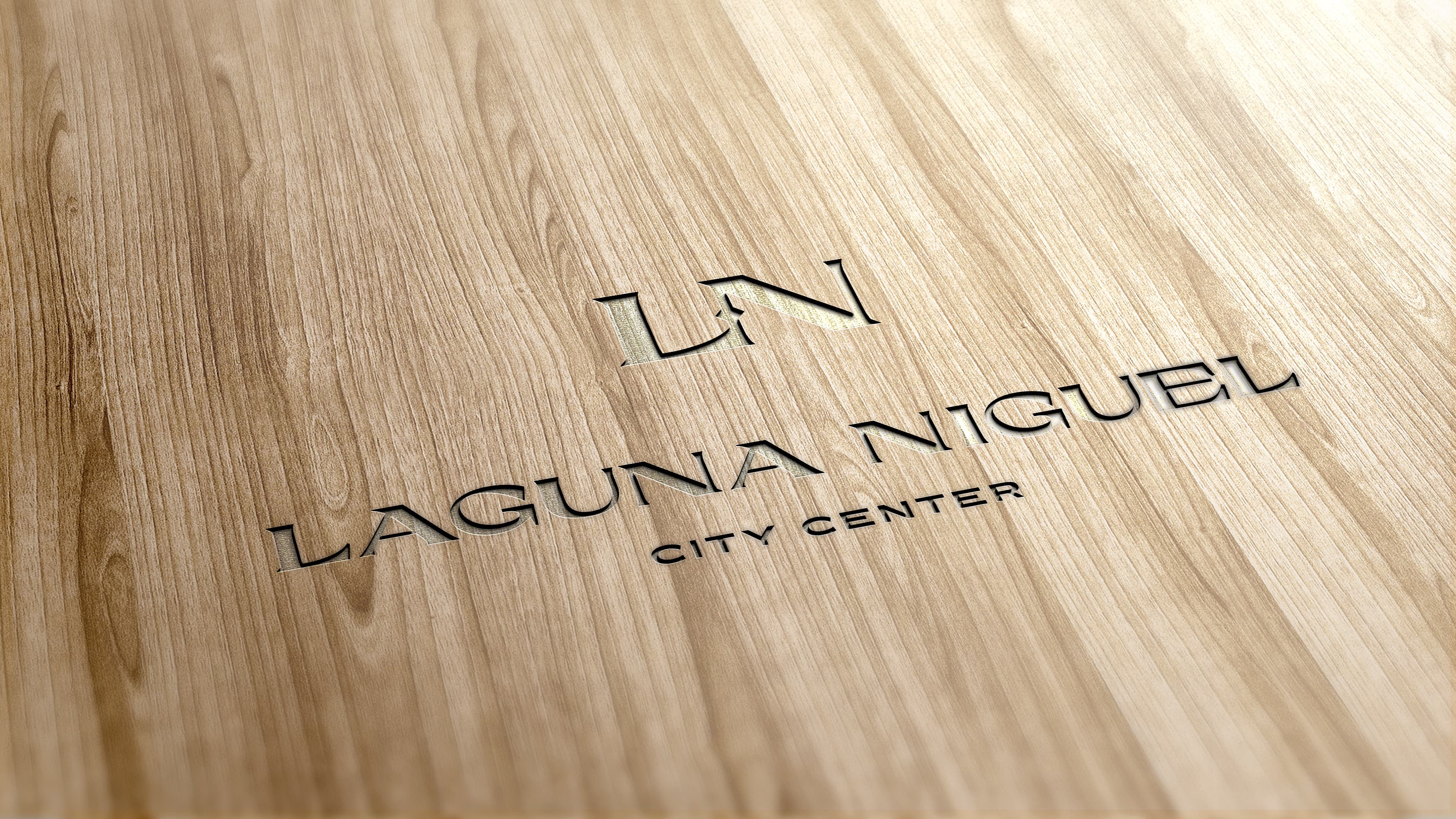 Laguna Niguel City Center logo engraved in a piece of natural wood.