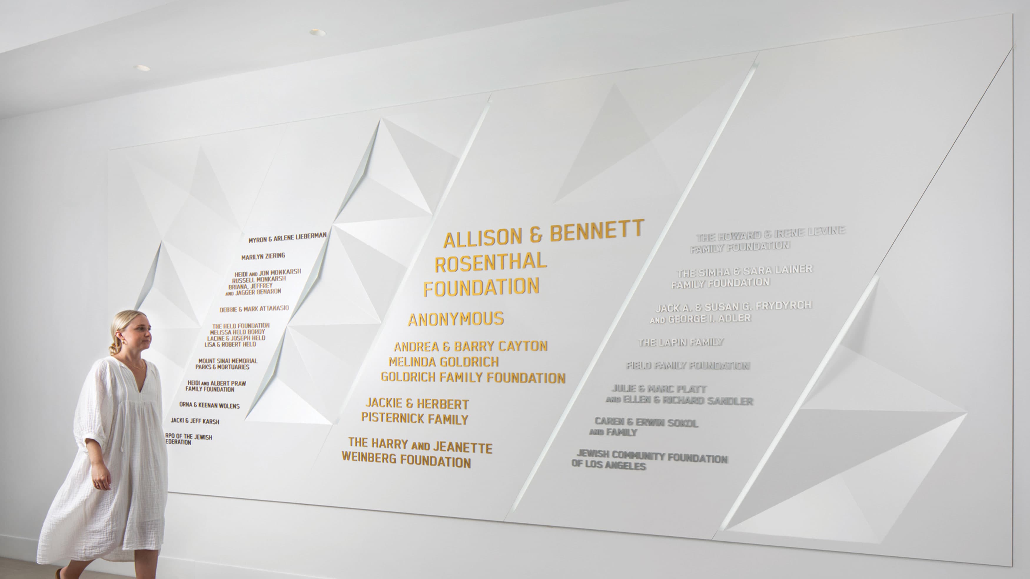 Donor recognition signage for the BAR Center in Venice, California. Geometric donor wall with gold, silver, and rose gold lettering. 