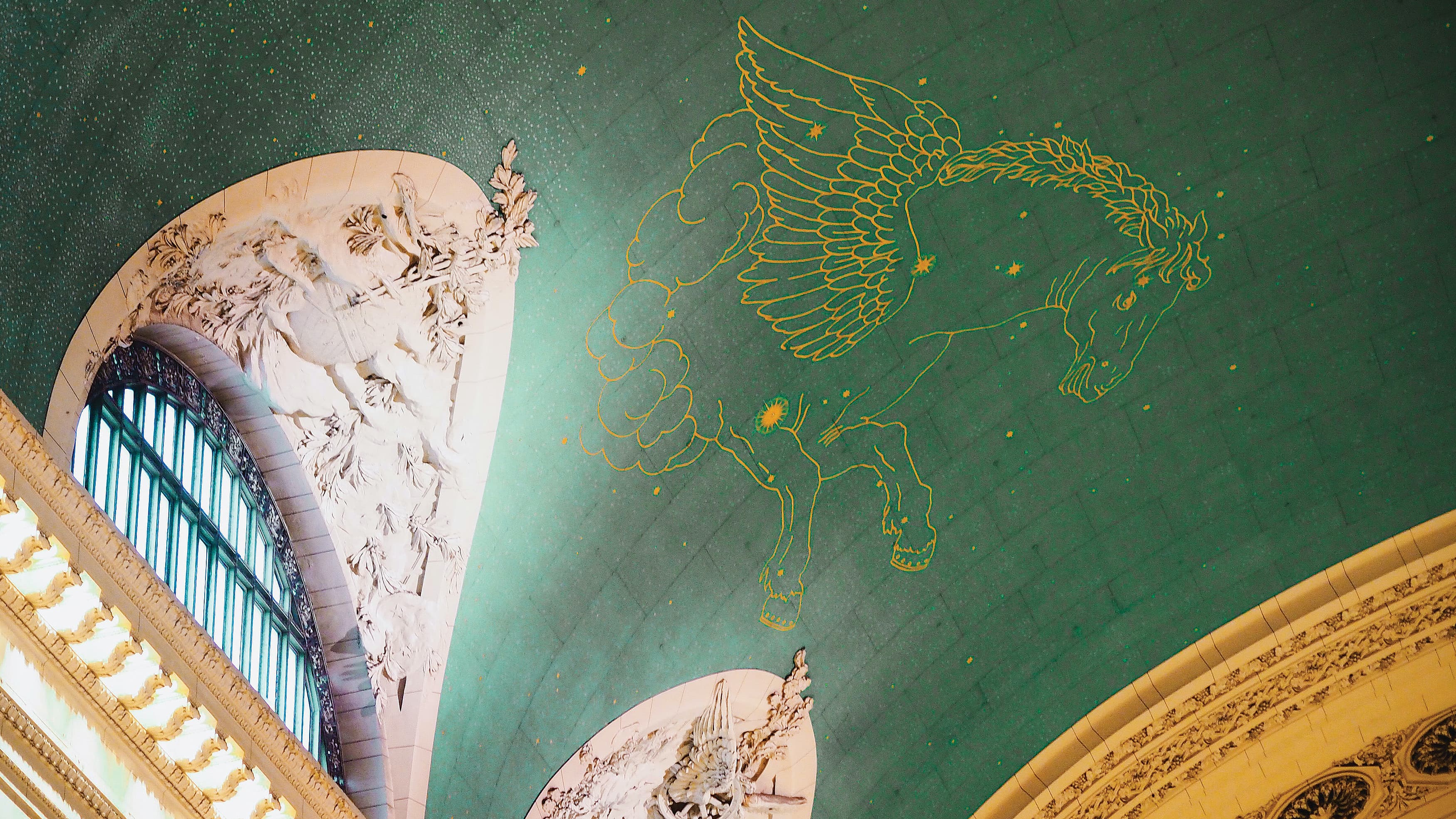 Painted mural on the large ceiling of Grand Central Terminal in New York City.