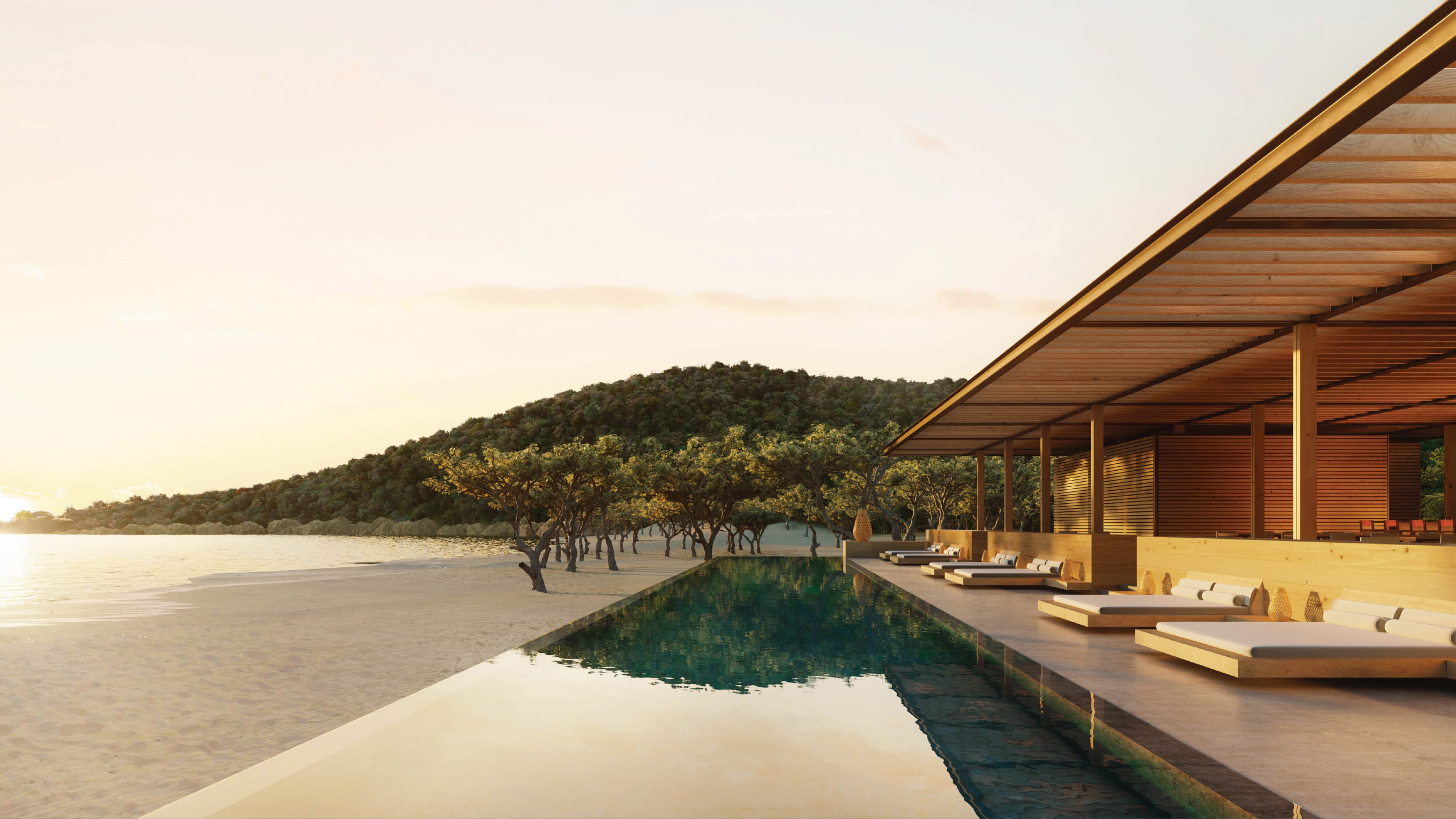 Rendering of an infinity pool alongside a wooden pavilion with lounge daybeds, set on a sandy beach with sparse trees and a forested hill in the background at sunset.
