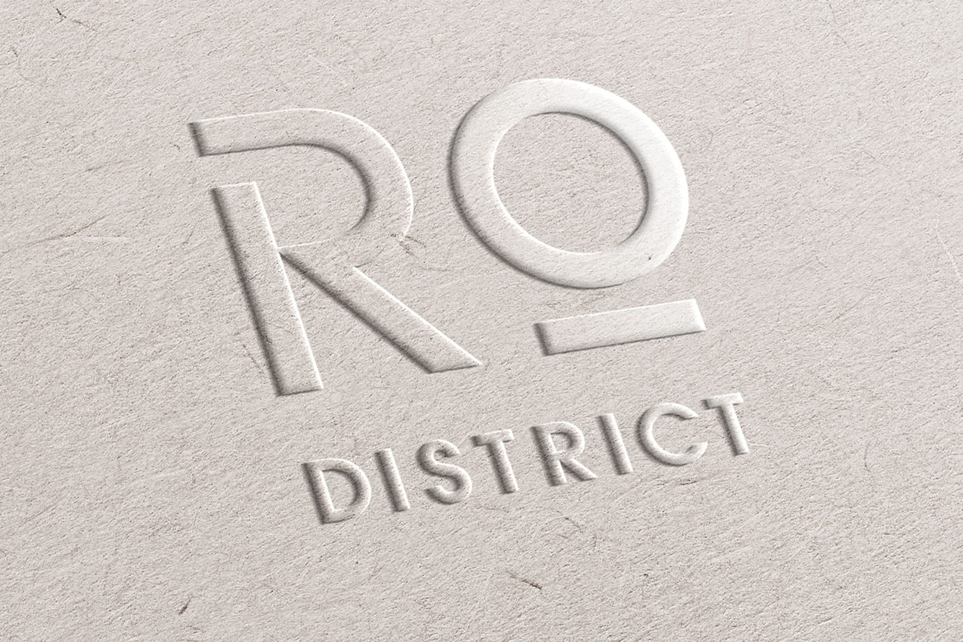 River Oaks District Houston embossed logo mark on textured paper, brand identity design by RSM Design