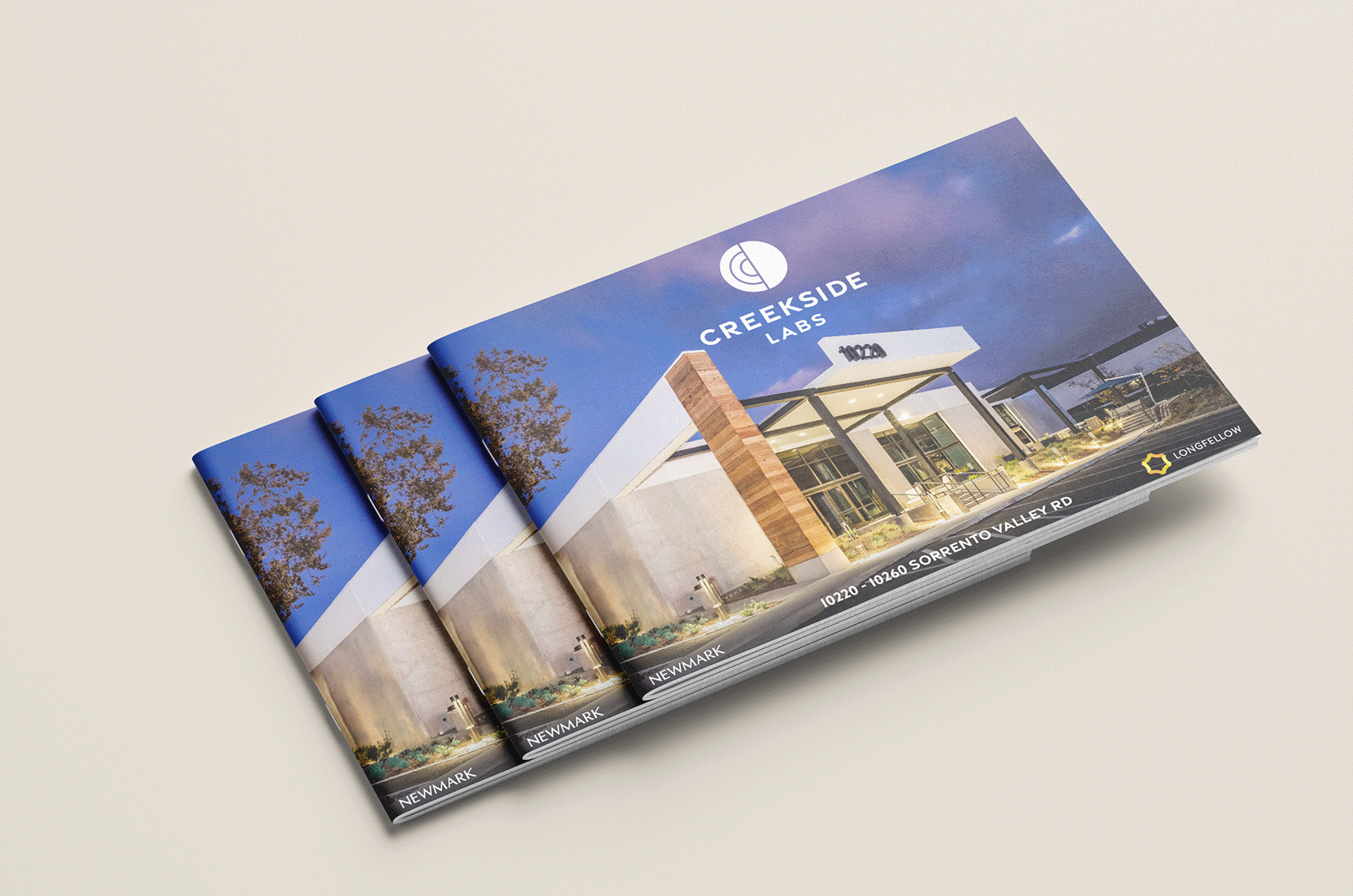 Animated graphic of Creekside Labs branded marketing brochures featuring the innovation campus architecture, illustrating brand strategy, graphic design, and brand identity development for a corporate workplace and life sciences research campus.