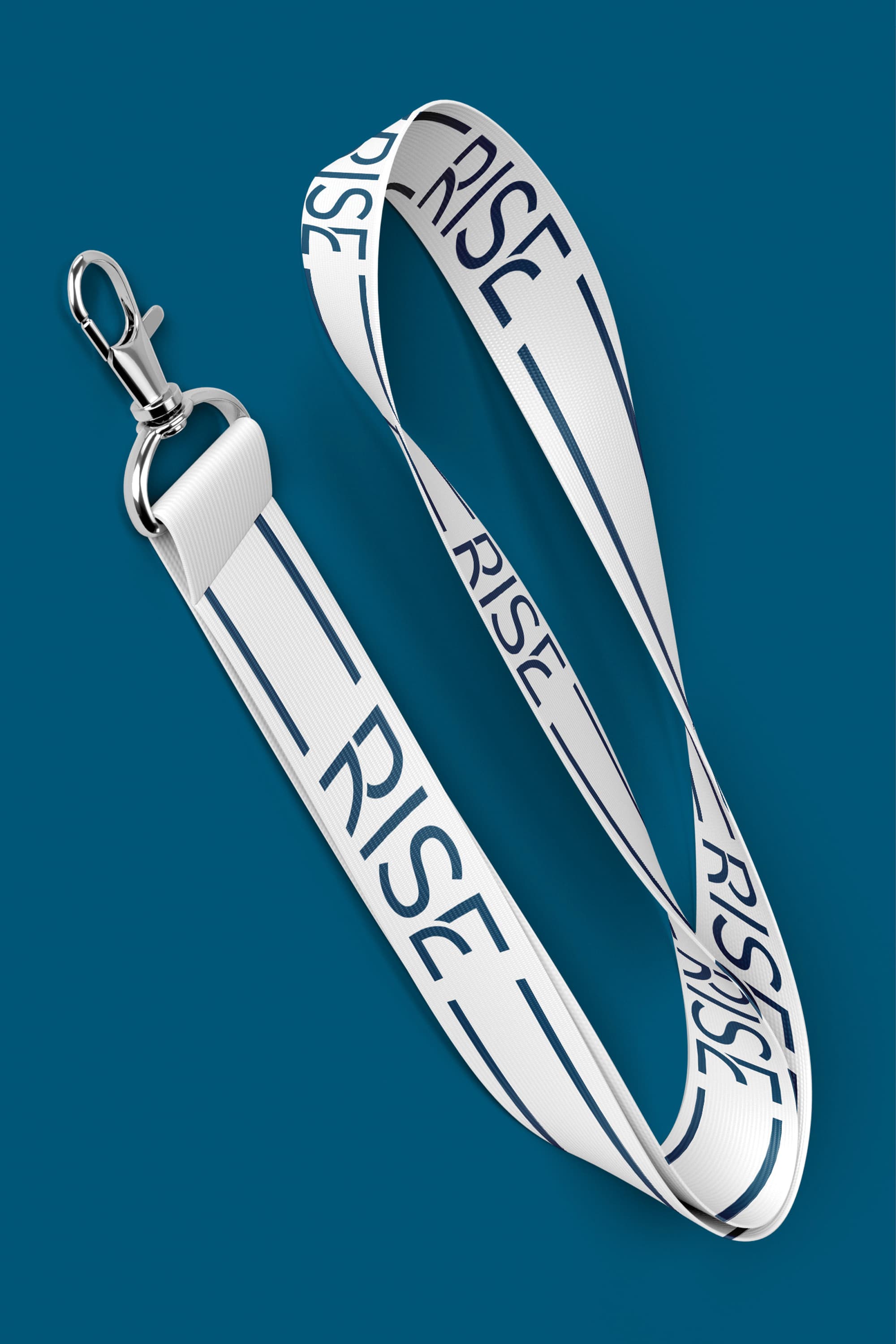 White lanyard with a repeating navy 'RISE' wordmark and a silver metal clip, coiled on a solid teal background.