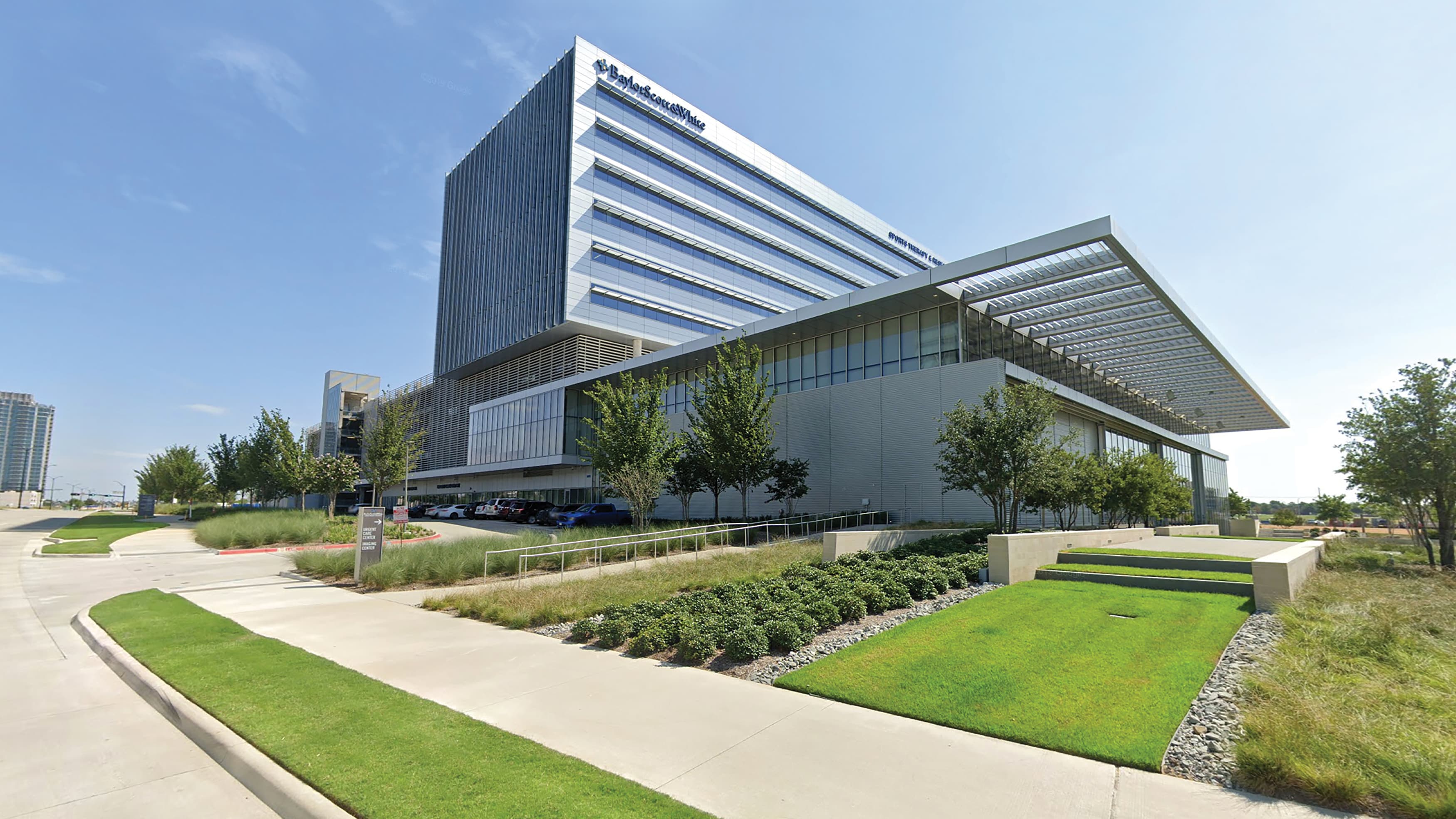 An exterior photograph of the Baylor Scott & White Sports Therapy & Research building at The Star in Frisco, Texas.