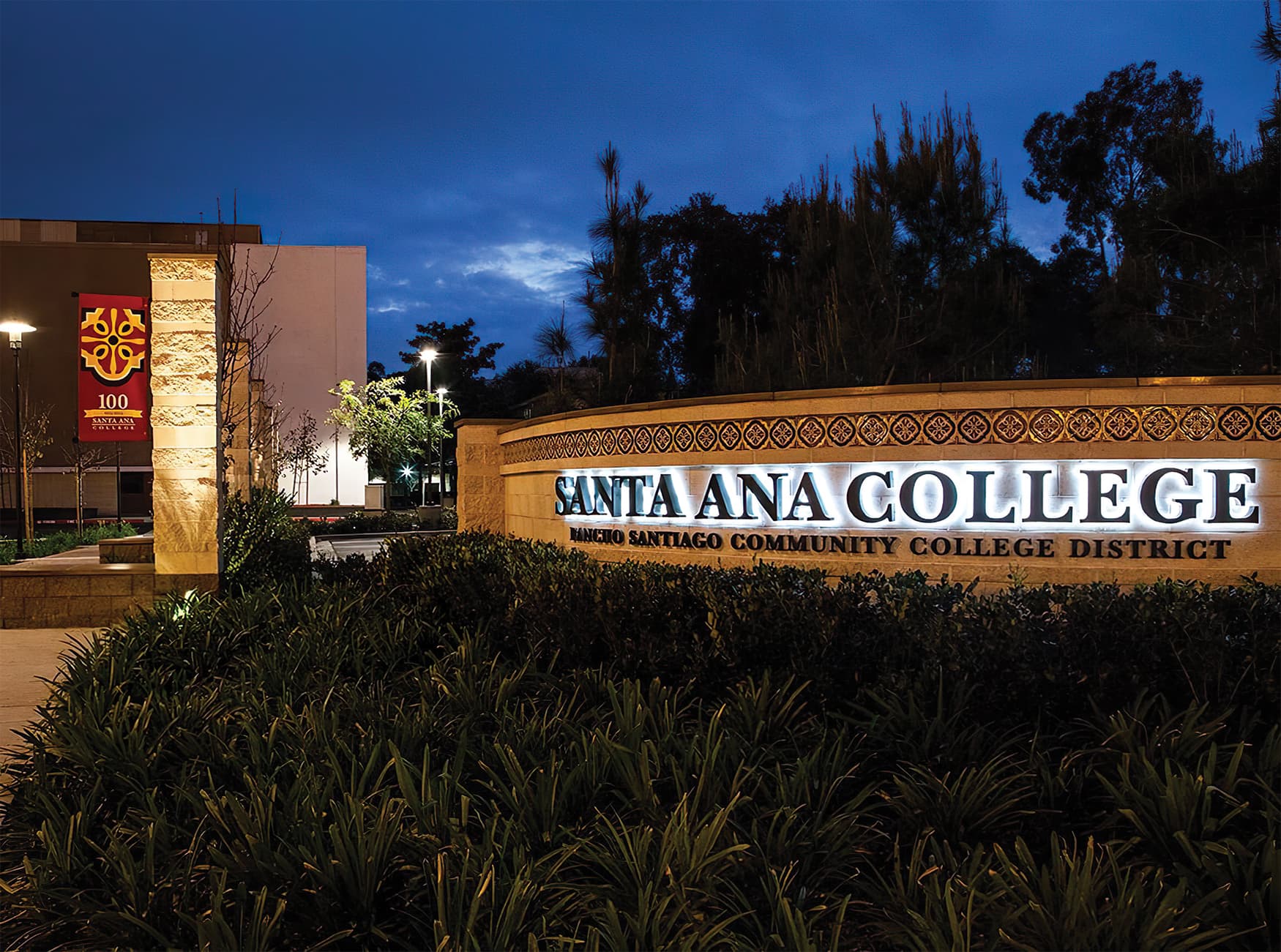 RSM Design worked with Santa Ana College to create a wayfinding system and public art system for the higher-education campus. Illuminated Project Identity on Landscape Wall.