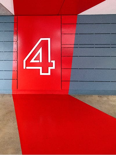 Bold level 4 parking garage wayfinding graphic at Runway Playa Vista in Los Angeles, designed as part of the environmental graphics and signage program by RSM Design.