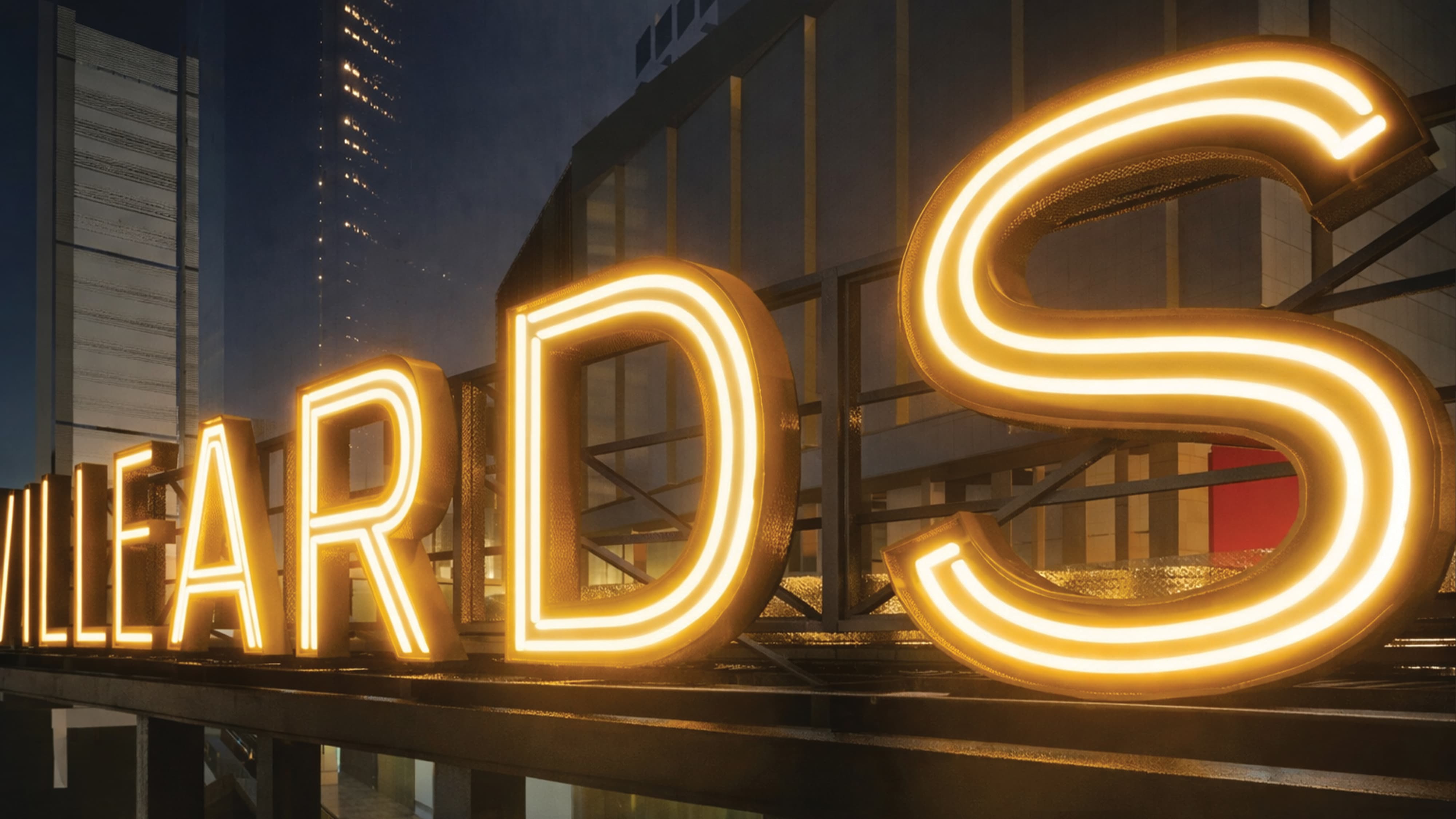 Architectural rendering of large-scale illuminated rooftop channel letter signage reading "Villeyards" glowing gold against a nighttime urban skyline, showcasing experiential graphics and branded environment design for a mixed-use waterfront development by RSM Design.