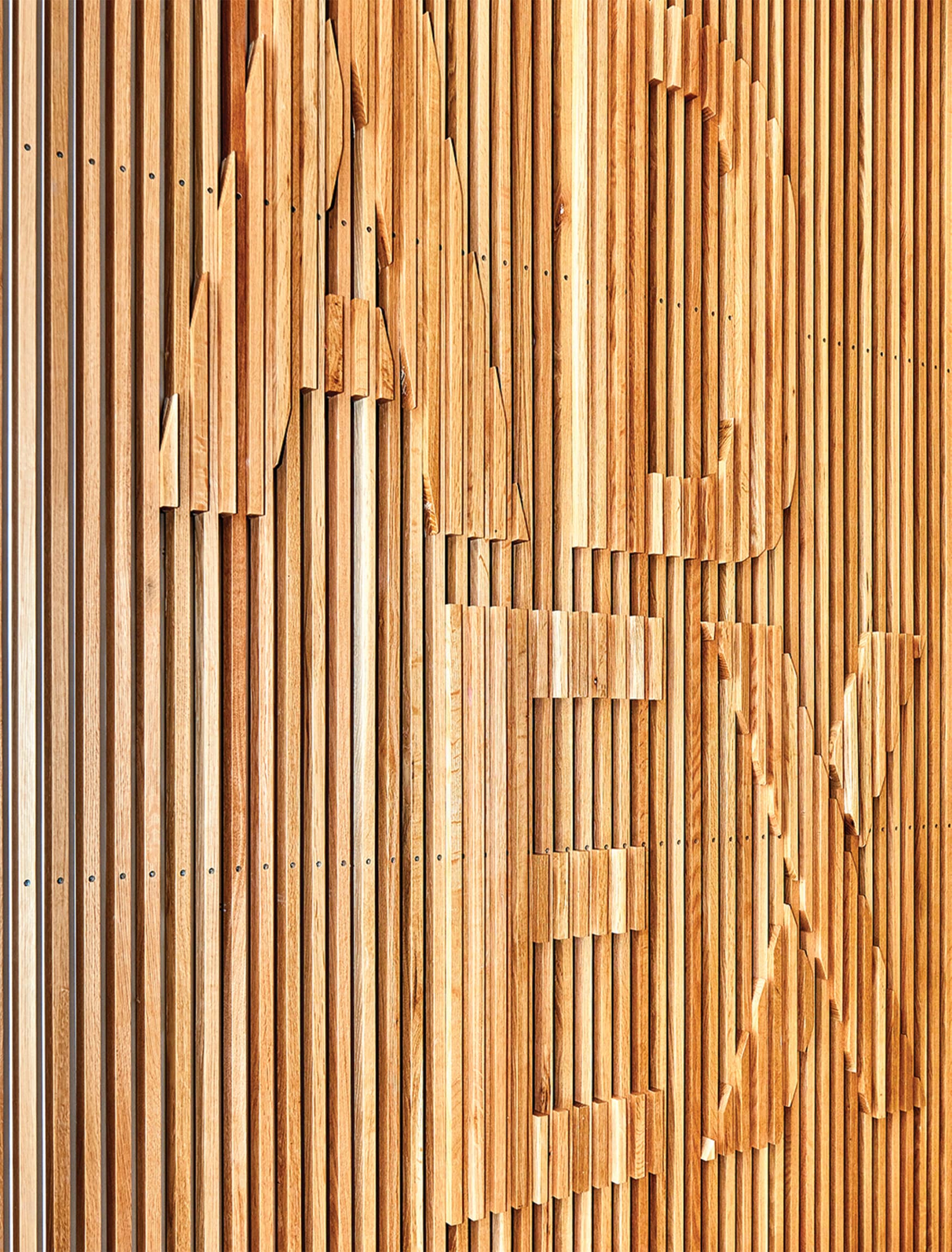 Architecture and Design Exchange wood-slat-relief signage