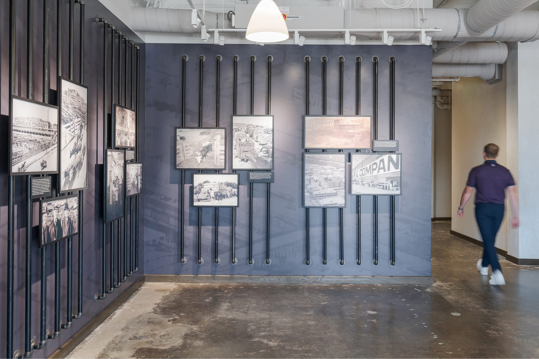 The Armour Stockyards interior lobby with historic archival photo displays, environmental graphic design by RSM Design