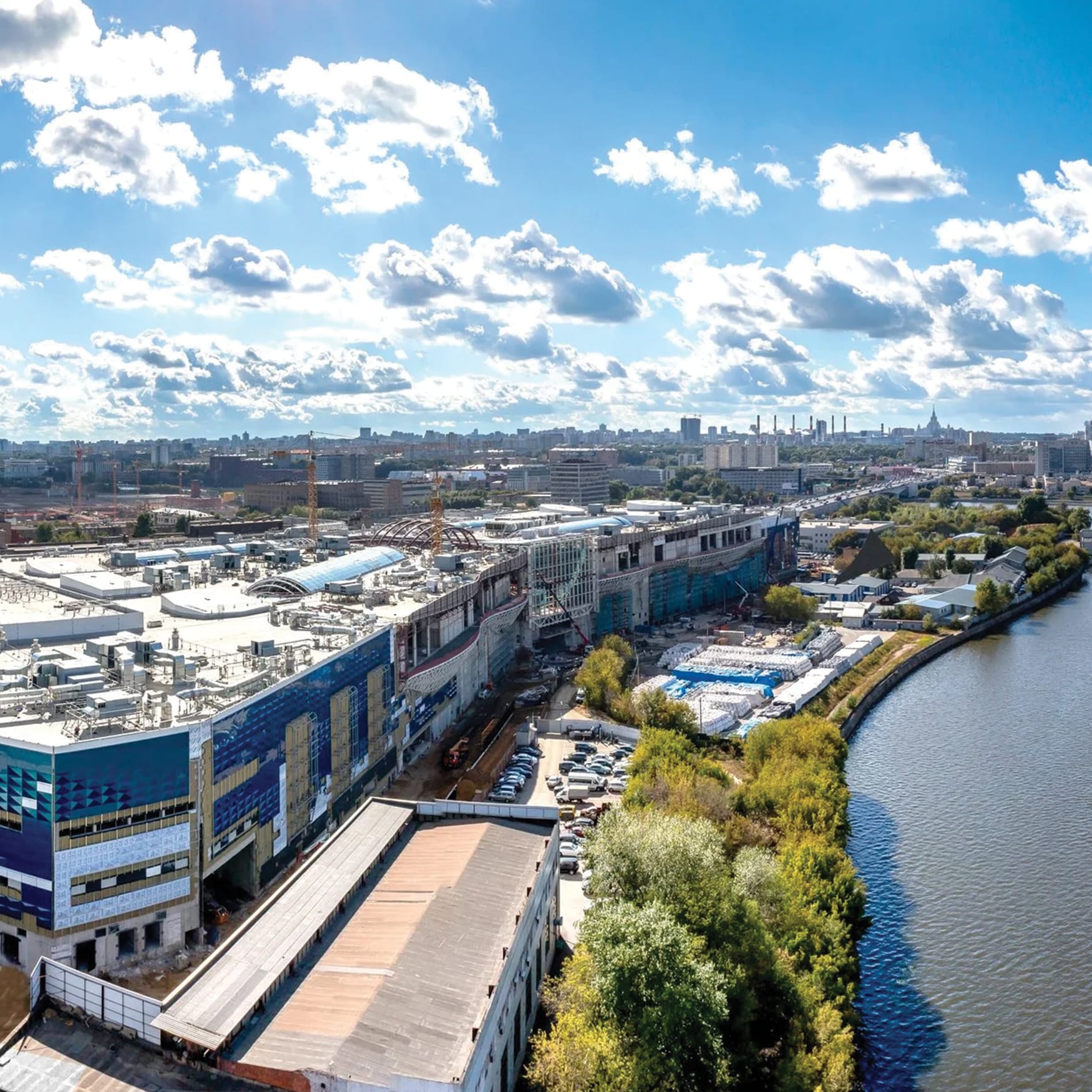 Aerial view of large shopping mall construction along the Moscow River embankment in Moscow, Russia.