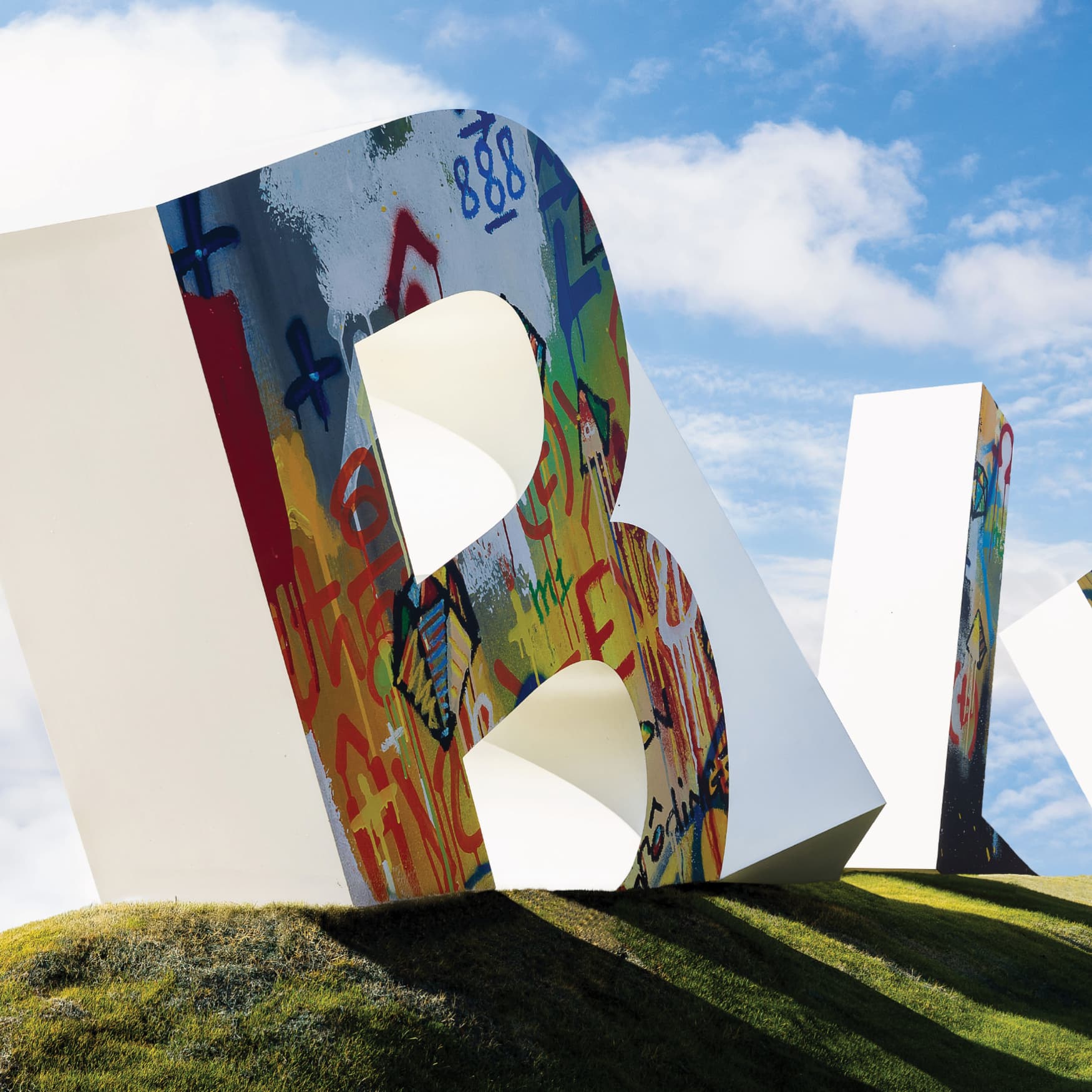 Image of the oversized letters for the entrance of Bel Air Village, a residential community in Sherman, Texas. Letter signage was designed by RSM Design in collaboration with artist Cyril Kongo.