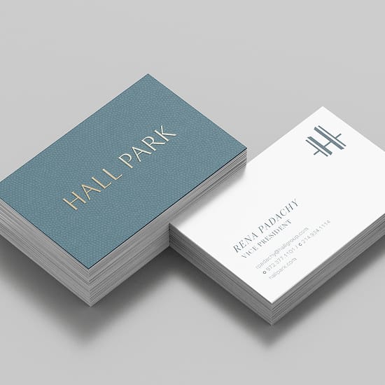 Business card mockup with a foil-stamped "Hall Park" logo and staff contact card - brand identity by RSM Design