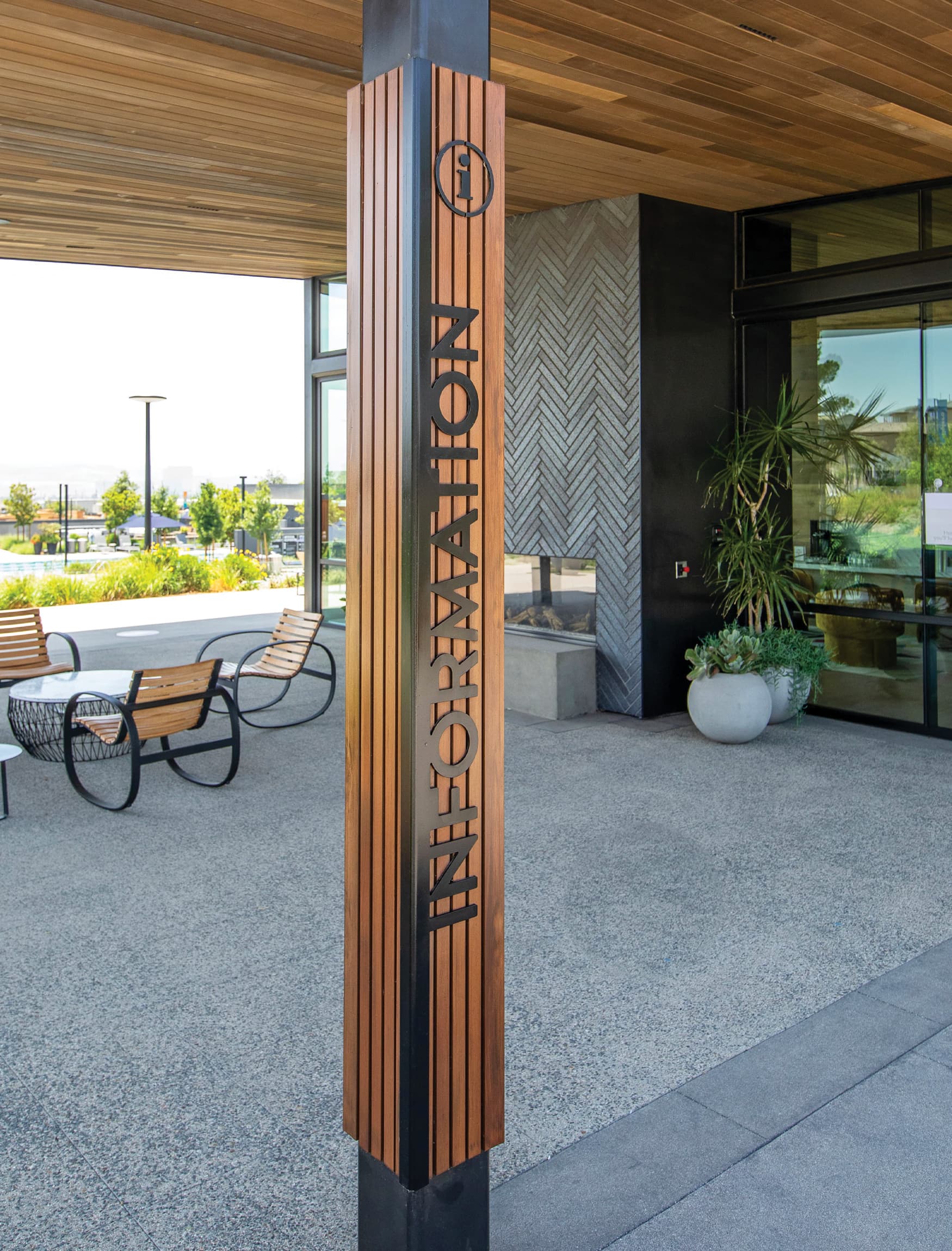 Wooden vertical information sign for Rise Park in Irvine, California.