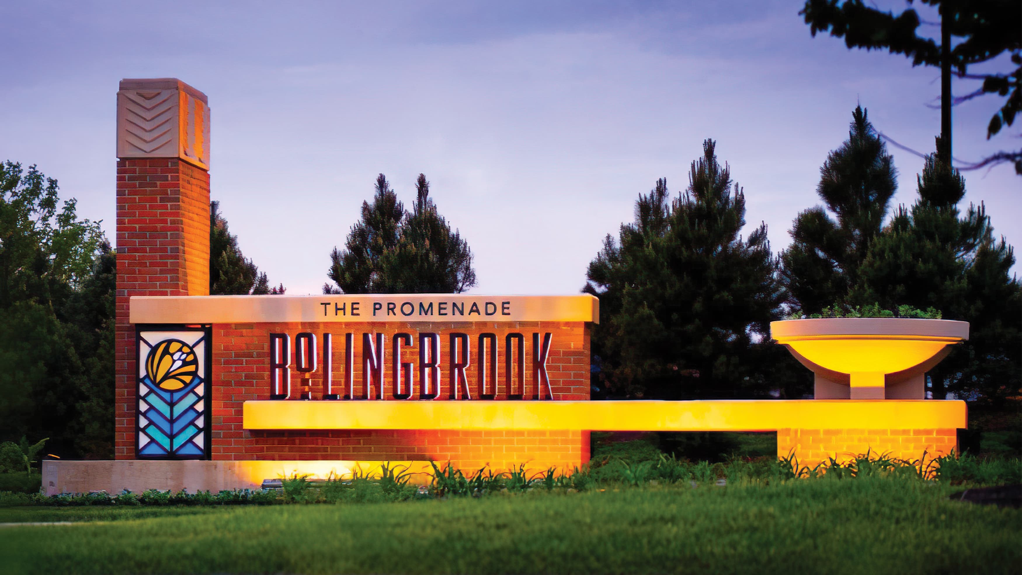 Architectural brick wall featuring Bolingbrook identity at dusk