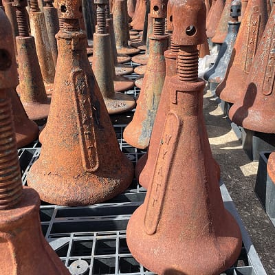 Close-up of rusted industrial jacks and metal equipment with textured patina, highlighting the historic manufacturing and industrial legacy of the Pearl Brewery site in San Antonio.