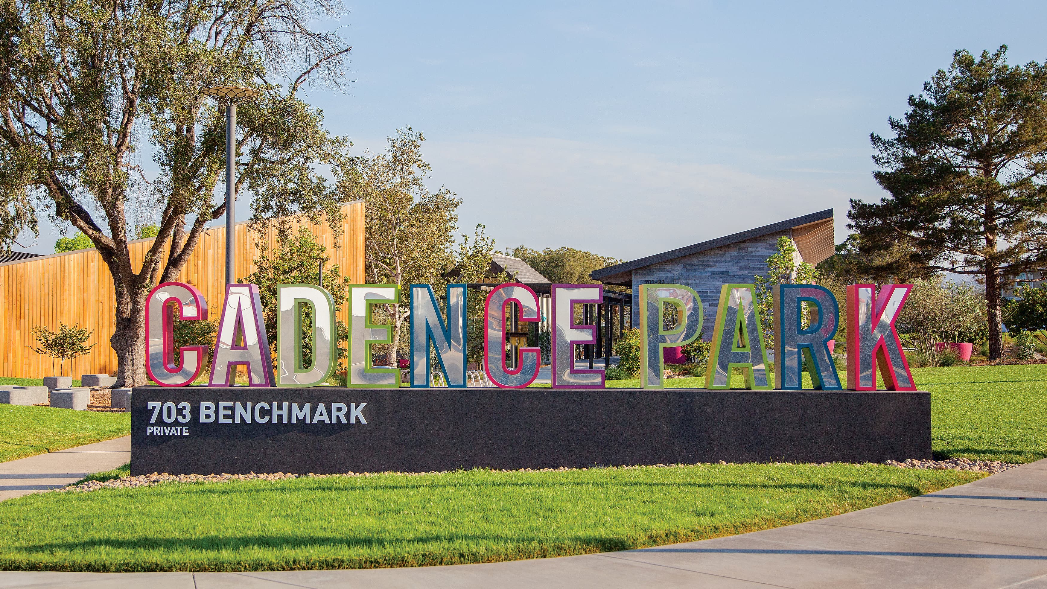 An image of a horizontal monument identity with playful coloring at Cadence Park.