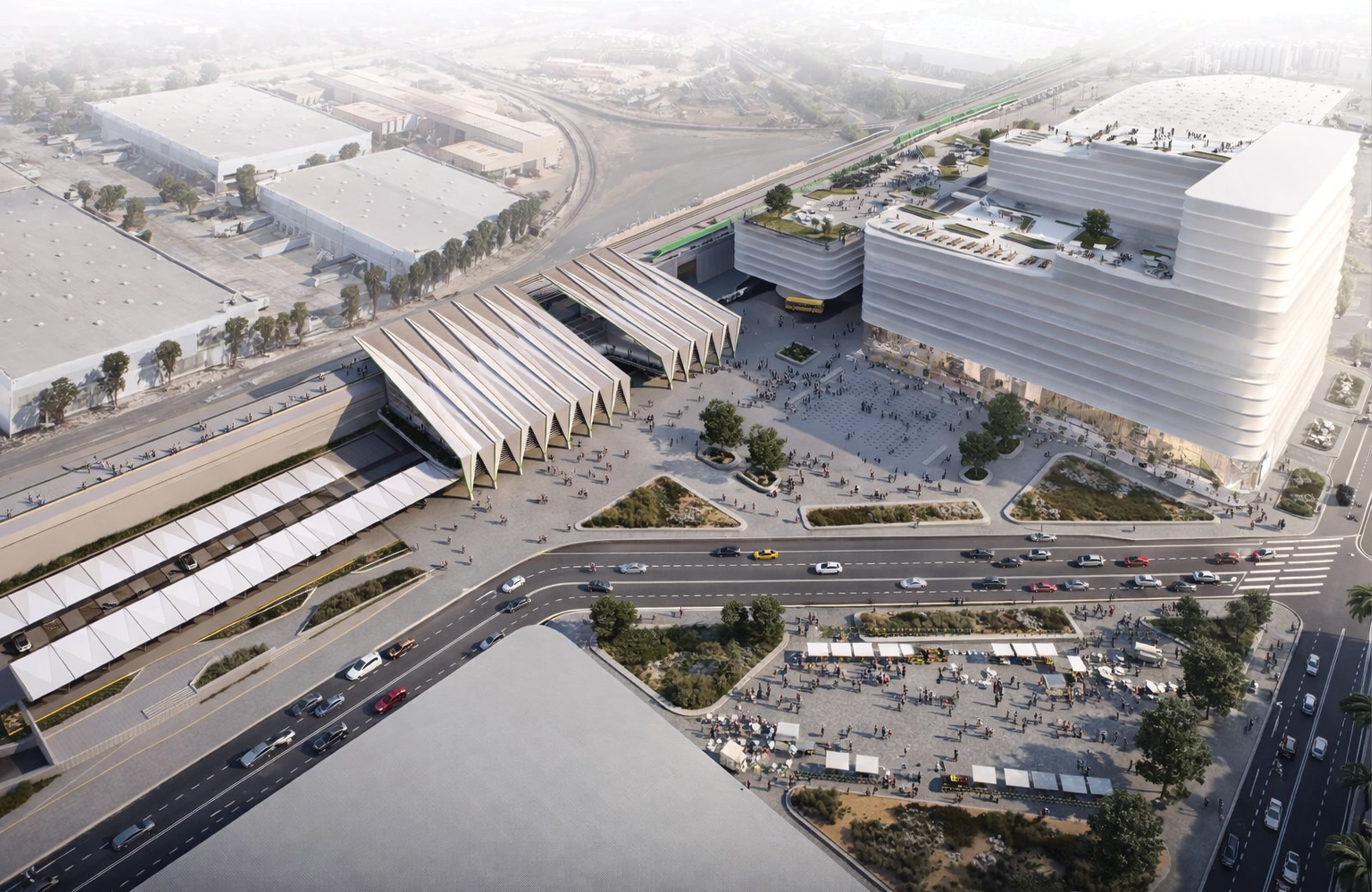 An aerial architectural rendering of a large-scale intermodal transit hub featuring a dramatic ribbed canopy structure, monorail infrastructure, multi-level parking garage, active pedestrian plazas, street-level vehicular circulation, and an outdoor market gathering space — illustrating RSM Design's wayfinding and signage design, placemaking, and environmental graphic design services applied at a master plan scale within the transit and mixed-use markets