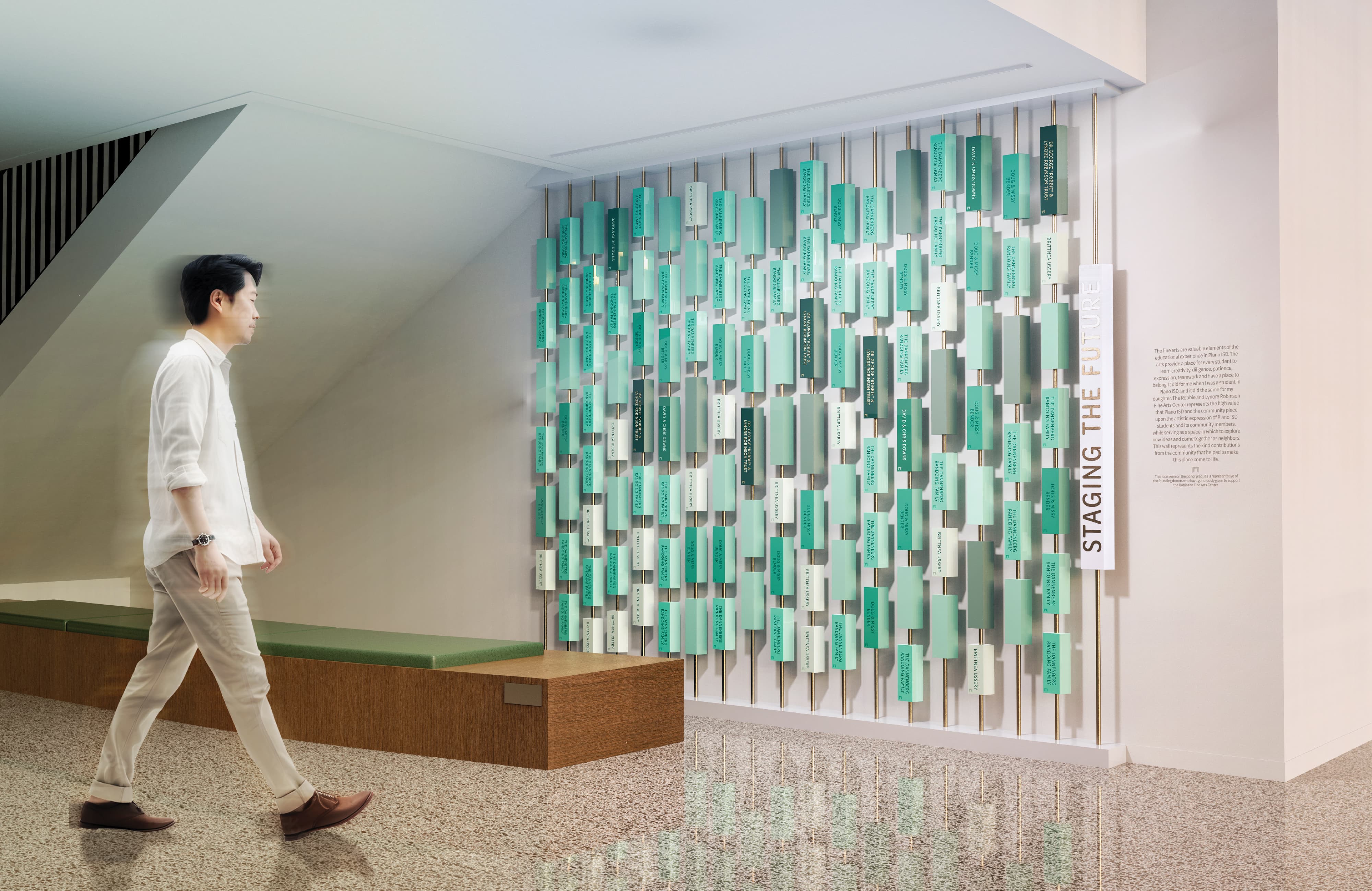 Experiential donor recognition wall titled “Staging the Future” featuring layered dimensional plaques and environmental graphic design that supports placemaking, storytelling, and branded environments in a higher education setting.