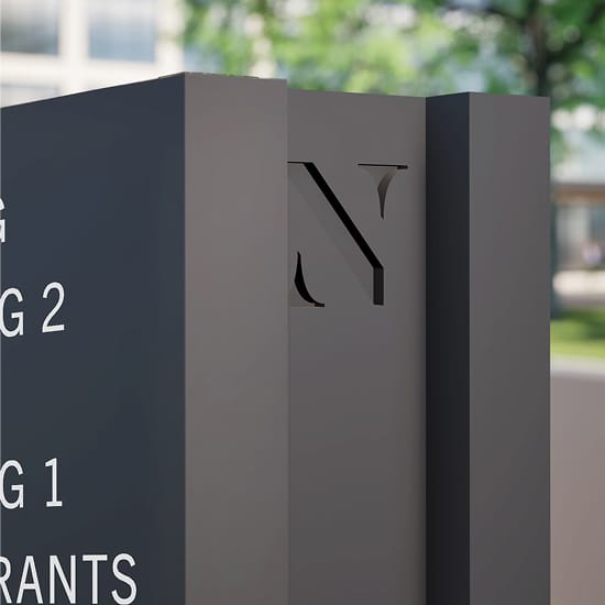 The North Rim directional sign detail with cutout logo mark, wayfinding design by RSM Design