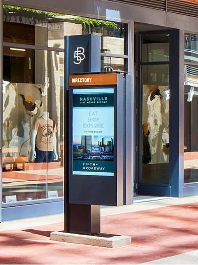 A compact digital directory provides clear, real-time information at the storefront level, extending the district’s identity while supporting intuitive, on-the-go navigation.