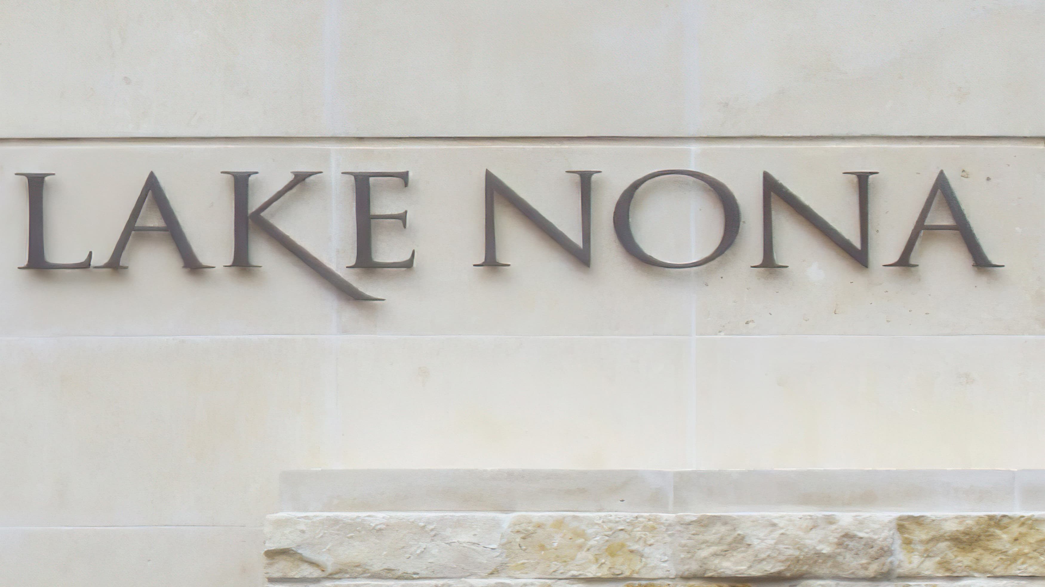 Dimensional Lake Nona brand identity applied to limestone monument