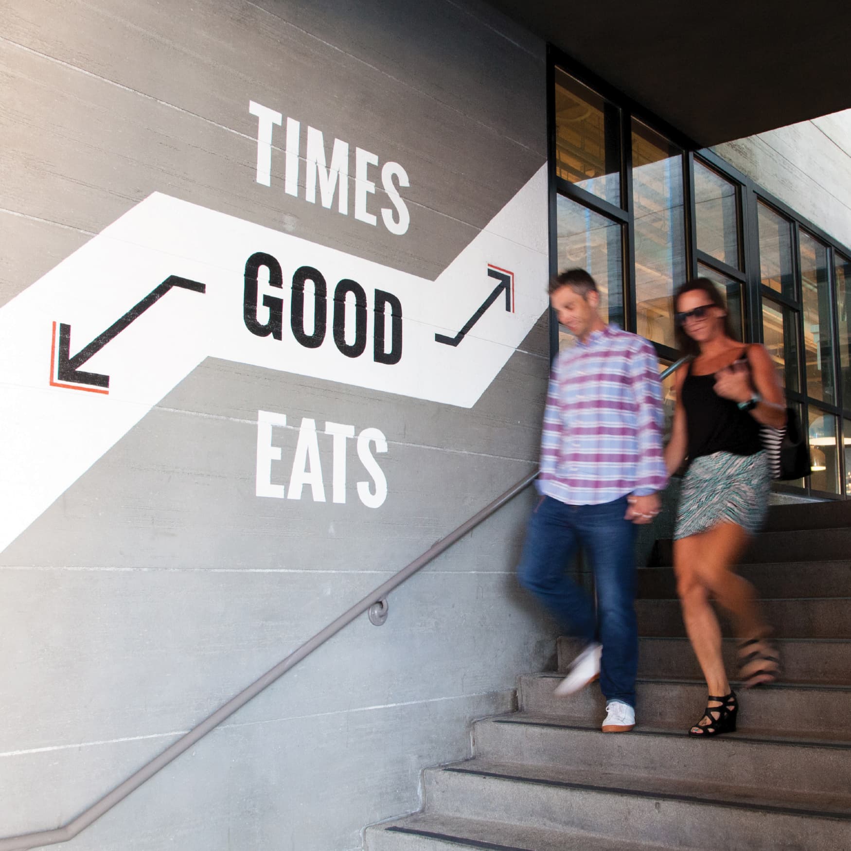 Wall specialty graphic reading Good Times and Good Eats, designed by RSM Design. 